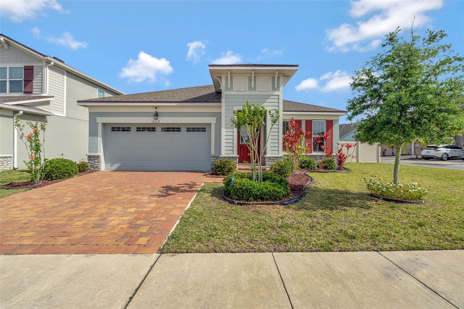 Location, location, location! This move in ready, light and bright home is located in the highly sought after gated Waterbrooke community, steps from the community amenities and with easy access to the Turnpike. It doesn't get better than this. This charming home features convenient one level open concept living with 3 bedrooms, 2 bathrooms and a flex/bonus space that can be a home office/den/living room/play room, or anything your lifestyle desires. The primary suite has an oversized closet with custom closet system as well as a second closet and primary bathroom with dual sinks. The great room and dining room are open to the gourmet kitchen with center island, granite counters, stainless steel appliances and walk in pantry with custom closet systems. The great room opens to the covered, screened patio area with pavers and looks onto the expansive, fenced back yard that is perfect for outdoor activities. The yard is oversized with room for pool and still have plenty of play space. The home sits on a corner lot allowing for the extra size as well as privacy. Inside laundry room with custom shelving drop zone. Well maintained with new exterior paint and new carpeting. The home sits steps from the community resort style amenities that include a pool, clubhouse, gym, playground, dog park, walking trails and lake. Easy access to the Turnpike, 429, downtown Clermont, downtown Winter Garden, downtown Orlando, hospitals, shops, restaurants and the attractions. Come see this immaculate home - why wait to build when you can have it today!