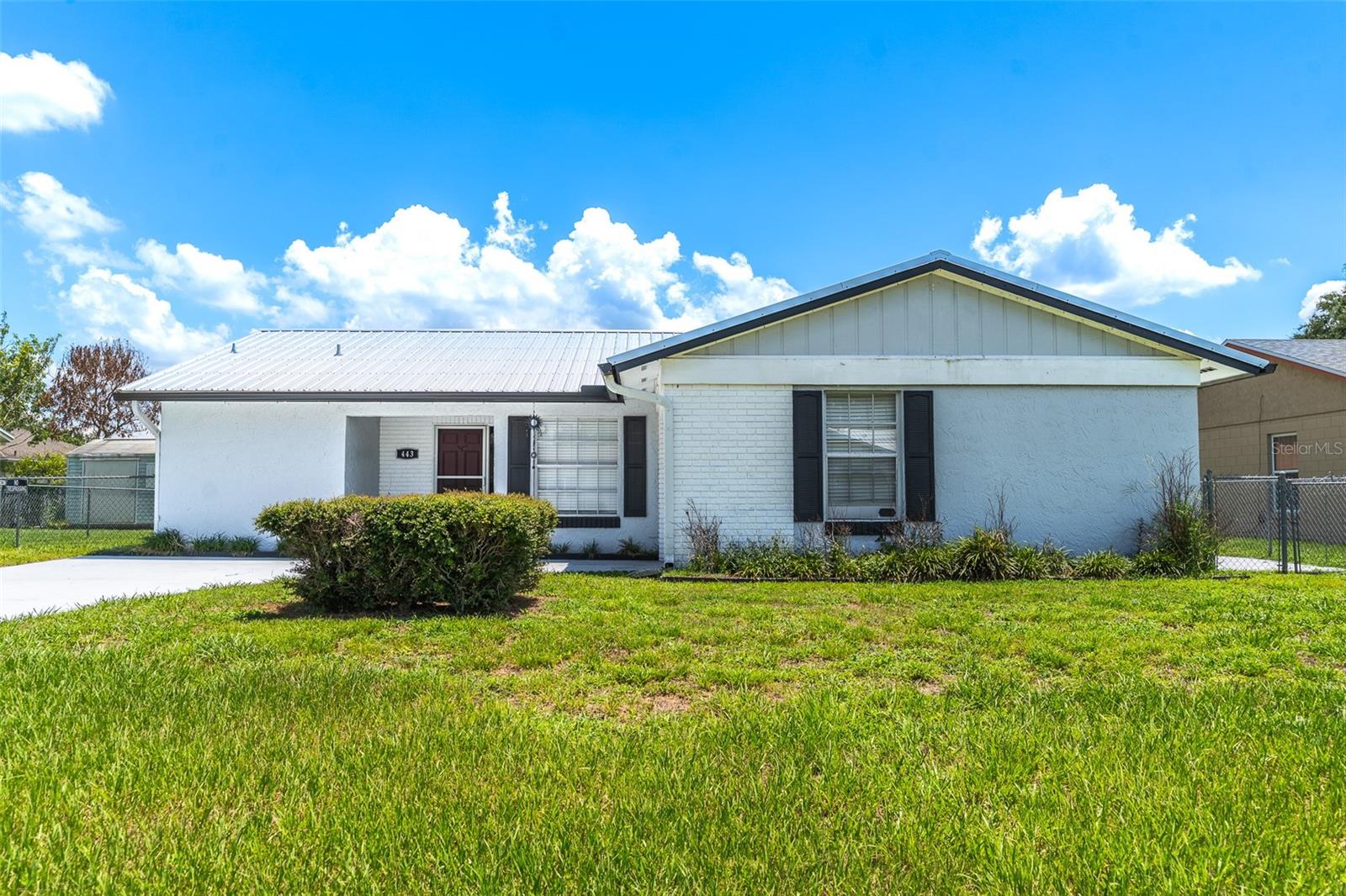Welcome to your beautifully maintained Florida retreat! This charming 2-bedroom, 2-bathroom home offers exceptional curb appeal with a NEW METAL ROOF reportedly installed in 2019 and featuring a LIFETIME WARRANTY. Inside, you'll find bright and inviting living spaces with easy-care ceramic tile flooring throughout, a spacious living room with direct access to the cozy screened lanai, and a functional kitchen featuring classic white appliances and abundant oak cabinetry. The primary suite is designed for comfort with a large walk-in closet and an en-suite bath featuring a walk-in shower and expansive vanity space. Additional highlights include a one-car attached garage with tiled flooring, an insulated garage door, built-in cabinetry, and a window that brings in natural light. Step outside to enjoy the fully fenced backyard, complete with a large storage shed offering plenty of room for tools, hobbies, or extra storage. The low monthly HOA fee includes high-speed internet, cable TV, and trash service, adding incredible value and convenience. Ideally located just minutes from shopping, restaurants, schools, community pools, and parks, including the popular Poinciana Community Park and Dog Park, this home also offers easy access to the scenic Lake Marion Creek Wildlife Management Area, known for its outdoor recreation, hiking, and fishing opportunities. Whether you're looking for a full-time residence, seasonal getaway, or investment opportunity, this move-in-ready gem offers the perfect blend of comfort, convenience, and Florida living.