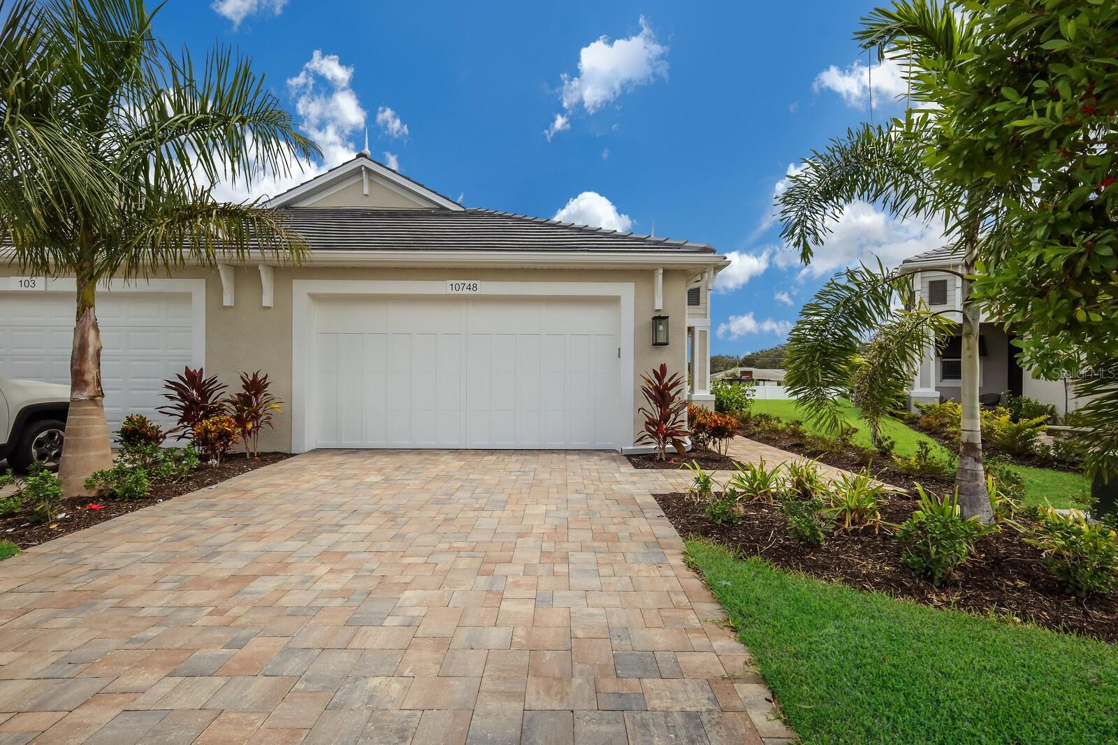 Discover effortless Florida living in this beautifully appointed Boca Grande Villa in the gated community of Watercolor Place. Built by Medallion Home, a respected semi-custom builder serving Southwest Florida since 1984, this move-in ready residence offers 2 bedrooms, 2 bathrooms, a versatile den, and 1,629 square feet of thoughtfully designed living space.

Designed with quality and style in mind, the home features wood-look tile flooring throughout, elegant tray ceilings, impact-resistant windows and doors, and a gourmet kitchen that's perfect for everyday living and entertaining. Step outside to your private screened lanai with a relaxing spool, creating the ideal setting to unwind and enjoy Florida's year-round sunshine.

Watercolor Place offers the best of low-maintenance living with no CDD fees and exclusive amenities for villa residents, including a private clubhouse with community pool and spa. Ideally located just minutes from Lakewood Ranch, Costco, Target, restaurants, and everyday conveniences, this home offers the perfect blend of luxury, comfort, and convenience.