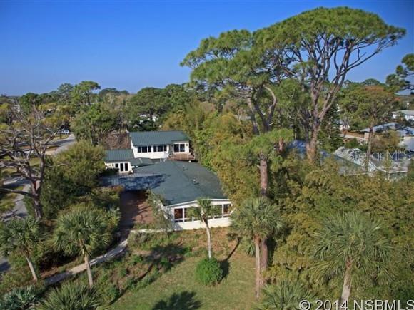 Direct Intra-Coastal Waterfront. Unique private compound located on Edgewater's most desirable road. This home was remodeled in 2003 and than a large 2 story addition was added in 2007. The main house features an open floor plan with water views from the living, Dining, kitchen and Family Rooms. Kitchen cabinets are Cherry with Stainless appliances and Gas Cooking. Large Butler Pantry. The 2 story addition offers a first floor Office/Study with floor to ceiling built in Book Cases, Credenza and Large Executive Desk with a Water View. The 2ND floor offers a Game Room with a built in Murphy Bed, additional Built in Cabinetry and great views of the River. There is an additional Bedroom with a Loft, a large closet and a Guest Bath with dual vanities and tub/shower. All cabinetry, interior doors are custom crafted. 4 separate A/C units. The Windows are high quality Impact Glass. There is a large Tiled Patio Area. The Oversized Garage is 914 Square Feet. Room for Cars and Toys.The house has been landscaped so that it is not seen by the cars passing on the street, but in the house the view to the River is unobstructed by the plantings. The dock can accommodate several boats. ;Water: City