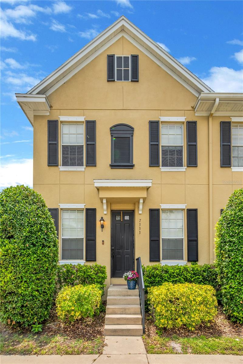Beautiful 3-bedroom, 2.5-bath colonial revival townhome with an oversized 2-car detached garage. Ideally situated at the end of a serene, tree-lined street in the heart of Port Tampa. This highly desirable end-unit residence is the only townhome in the community to feature no neighbors to the south, only wetland conservation.

Pride of ownership is evident throughout this exceptionally maintained and thoughtfully updated home. Step inside to discover a light filled, spacious open-concept living, dining, and kitchen area highlighted by newer wide-plank Pergo TimberCraft flooring, fresh neutral paint, crown molding, recessed lighting, and tasteful finishes throughout.

The chef-inspired kitchen features solid wood cabinetry, granite countertops, a tile backsplash, stainless steel appliances, a breakfast bar, and abundant prep and storage space. A generous walk-in pantry and conveniently located laundry room combination add to the home's functionality, while a well-appointed half bath completes the first floor. Designed for both everyday living and entertaining, the main living area seamlessly extends outdoors through a wall of sliding glass doors leading to a private patio—perfect for grilling, relaxing, and enjoying Florida's year-round sunshine.

The adjacent oversized 2-car detached garage is a rare find in a townhome, offering ample room for vehicles, storage, hobbies, and recreational equipment.

Upstairs, you'll find three spacious bedrooms and two full bathrooms. The primary suite features a walk-in closet and stunning en-suite bath complete with a dual-sink quartz vanity, frameless glass shower enclosure, porcelain tile, and brushed chrome fixtures. The bright and airy secondary bedrooms share a well-appointed full bath with a tub/shower combination.

An outstanding opportunity for homeowners and investors alike, the community is an intimate, well-planned neighborhood consisting of just 25 townhomes nestled among 52 single-family homes. The financially sound HOA maintains strong reserves and provides exceptional value, with dues covering exterior maintenance and painting, roof replacement (2025), landscaping, and more.

Elevated above the floodplain, this home remained high and dry during recent storms and requires only minimal flood insurance. Enjoy convenient access to shopping, dining, entertainment, Tampa International Airport, MacDill Air Force Base, International Plaza, Hyde Park, Water Street/Channelside, Tampa General Hospital, Downtown Tampa, St. Petersburg, and miles of Gulf Coast beaches.

Don't miss this rare opportunity to enjoy low-maintenance living in one of South Tampa's most desirable locations. Welcome home!