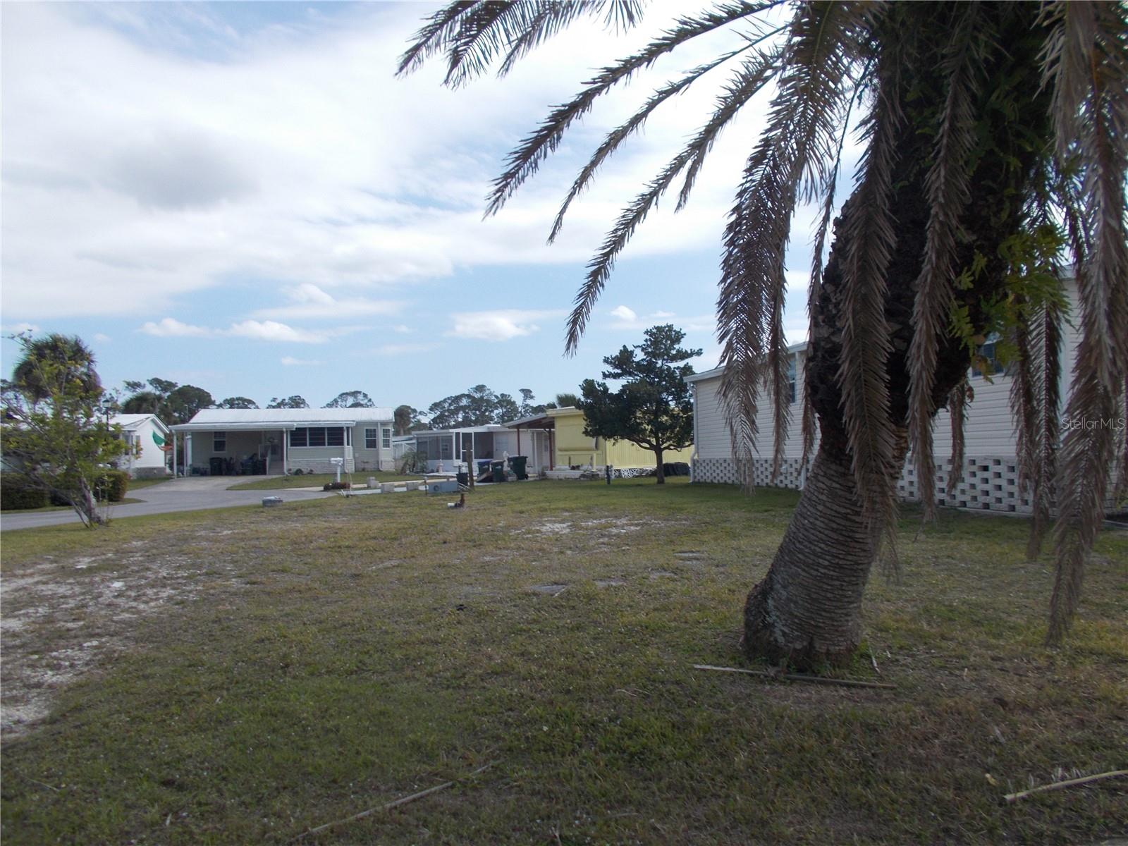 Vacant land in sought after Gated Community of Holiday Park, not in the pet section.  In Holiday Park you own the land with a deed and the maintenance fee of $195.00 monthly ($2340.00 a year) is included in your taxes.  This is a corner lot measuring 3623 sq ft.  Holiday Park offers many amenities including 2 Pools, Tennis Courts, Pickle Ball, Bocci, Shuffleboard, Laundry, Library, Tennis, Horseshoes, Bingo plus other card games, Fitness Room and so much more.  This is a perfect place for your new manufactured home.  Come and see!