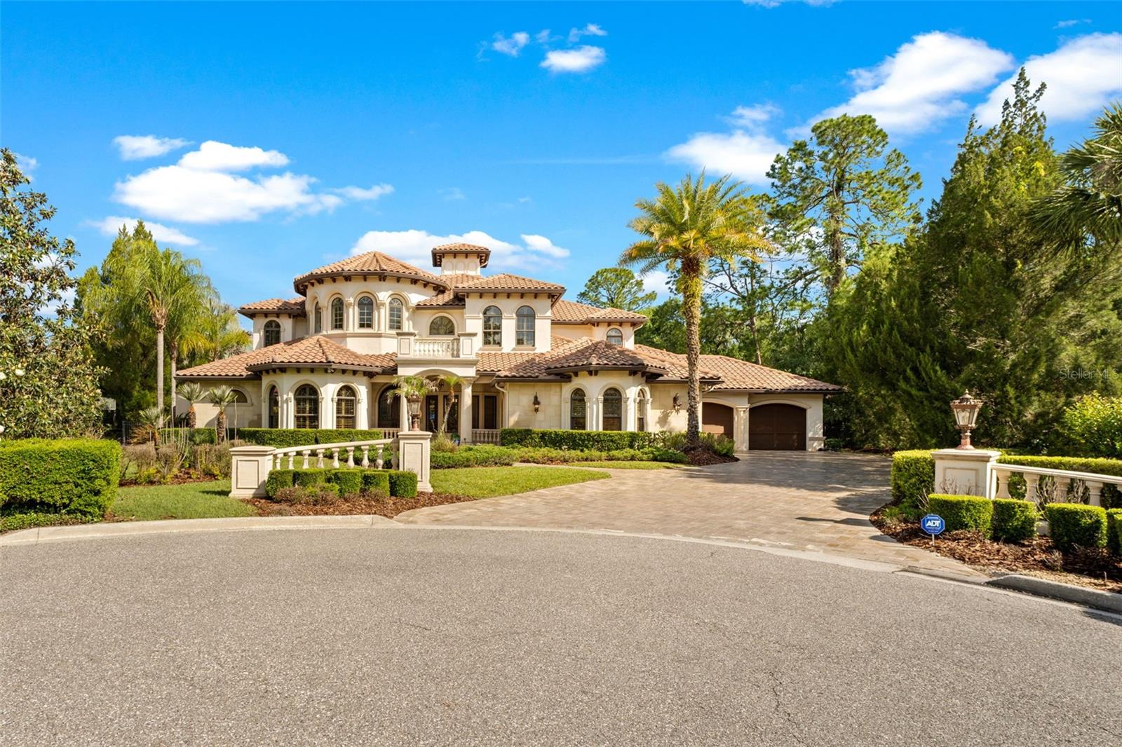 Welcome to an exceptional GOLF COURSE–FRONT ESTATE in the prestigious, 24-HOUR GUARD-GATED community of THE RESERVE AT TAMPA PALMS, where timeless architecture meets a true RESORT-STYLE LIFESTYLE. Ideally positioned on the 4TH HOLE OF TAMPA PALMS GOLF & COUNTRY CLUB, this 5 BEDROOM, 5.5 BATHROOM residence with STUDY, THEATRE ROOM, GAME ROOM, and PRIVATE ELEVATOR offers an unparalleled combination of SPACE, LUXURY, and FUNCTIONALITY.

From the moment you enter the 30+ FT SOARING FOYER with a custom chandelier, you are greeted by sweeping GOLF COURSE AND POOL VIEWS. The thoughtfully designed floor plan features formal living and dining spaces, an executive office with access to the primary suite, a FIRST-FLOOR GUEST SUITE WITH EN-SUITE BATH, and expansive ENTERTAINING AREAS.

The GOURMET CHEF’S KITCHEN has been updated with quartz countertops, new lighting and fixtures, complemented by top-of-the-line appliances including a WOLF GAS RANGE with POT FILLER, DOUBLE OVENS, multiple refrigeration drawers, ice maker, warming drawers, TWO DISHWASHERS, and a BUILT-IN MIELE CAPPUCCINO/COFFEE BARISTA SYSTEM. A CLIMATE-CONTROLLED WINE ROOM/CELLAR adds a refined touch, creating the perfect space for both ENTERTAINING and everyday living.

The primary suite offers a true PRIVATE RETREAT with a sitting area and a spa-inspired bathroom featuring a ROMAN-STYLE SHOWER, THERMASOL STEAM SYSTEM, dual vanities, and two custom CALIFORNIA WALK-IN CLOSETS. Upstairs, THREE EN-SUITE BEDROOMS provide comfort and privacy for guests, along with a SPACIOUS GAME ROOM and access to a newly updated BALCONY.

Designed for both ENTERTAINMENT AND CONVENIENCE, the home includes a PRIVATE THEATRE ROOM, a WHOLE-HOME AUDIO SYSTEM, and SMART HOME TECHNOLOGY allowing control of lighting, climate, and media.

Step outside to a true RESORT-STYLE OUTDOOR OASIS, fully reimagined with a HEATED INFINITY POOL AND SPA featuring a NEW PEBBLE-TEC FINISH, UPDATED LED LIGHTING, and a stunning golf course backdrop. 
The EXPANSIVE LANAI offers an OUTDOOR KITCHEN, FIREPLACE, TV LOUNGE, and TWO FIRE FEATURES WITH MODERN FIRE GLASS, along with BUILT-IN MISTING SYSTEMS for comfort during warm Florida summers and seamless indoor-outdoor living through FLEETWOOD MULTI-PANEL SLIDING DOORS.

Additional recent upgrades include THREE HIGH-PERFORMANCE CARRIER INFINITY HVAC SYSTEMS, a NEW GENERAC GENERATOR WITH REMOTE MONITORING, NEW CARPET IN THE THEATRE ROOM, upgraded laundry with DOUBLE WASHER AND DRYER, and a garage equipped with LEVEL 2 EV CHARGING, CONNECTED DIRECT-DRIVE OPENER, and HURRICANE-RATED ACCESS DOOR.

Additional features include plantation shutters, 8-foot solid wood doors, gas or wood burning FIREPLACE, integrated home automation, and enhanced lighting and audio systems throughout.

Ideally located just minutes from I-75 AND I-275, USF, MOFFITT CANCER CENTER, and VA HOSPITAL, and a short drive to TAMPA INTERNATIONAL AIRPORT, premier shopping, dining, and entertainment, this home offers the perfect balance of luxury, location, and lifestyle.

Schedule your private showing today!