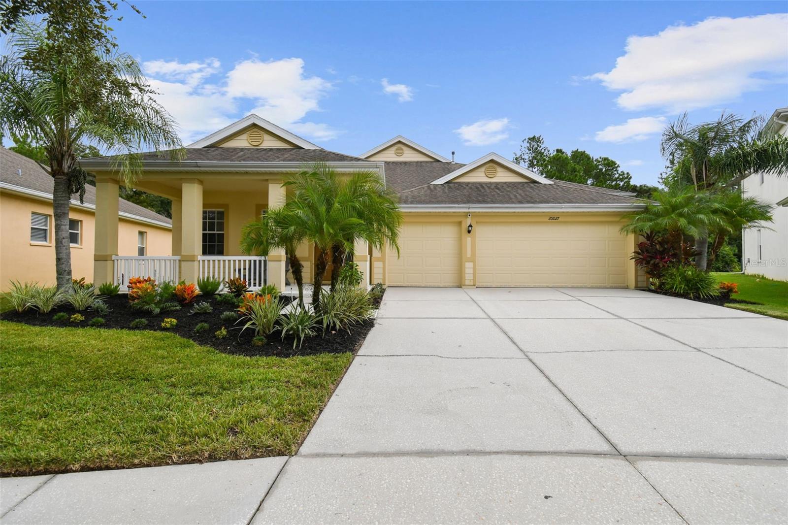 ATTENTION: NEW AC-2022, ZAP-CAP PROTECTION (TECO), GENERATOR INTERLOCK SET-UP (TRANSFER SWITCH), NEW GARBAGE DISPOSAL, NEW TOILETS, ALL LG APPLIANCES LESS THAN 1 YEAR, NEST THERMOSTAT, GAS STOVE                 
Welcome to resort style living. As you enter the SECURED GATED community of LIVE OAK PRESERVE, rest assured, you will feel the comfort and relaxation of a lifelong vacation in a family centered community.  This PRISTINE home engulfs CURB APPEAL and tranquility offering an abundance of NATURAL LIGHT that graces every corner of the home. From the moment you step through the door, you'll be greeted by GLEAMING PORCELAIN TILE FLOORS that not only add sophistication but also ensures EASY MAINTENANCE. Enjoy cooking dinner on a GAS STOVE, a large pantry for and 42 INCH WOOD CABINETS for storage. The MASTER SUITE IS A TRUE SANCTUARY with TWO GORGEOUS SIZED CLOSETS, perfect for organizing your wardrobe. The en-suite bathroom boasts a LUXURIOUS SOAKING TUB, ideal for relaxation after a long day. Car enthusiasts and homeowners with storage needs will appreciate the THREE CAR GARAGE, providing ample space for vehicles, equipment, and hobbies. 
Step outside to the EXPANSIVE SCREENED  LANAI, offering a peaceful oasis for outdoor dining, entertaining, or simply unwinding while enjoying the Florida sunshine LOOKING OUT TO A POND AND A CONSERVATION. This property's unique charm is matched by its unbeatable location known for its close proximity to SHOPPING CENTERS, RESTAURANTS, MALLS, PREMIUM OUTLETS and ENTERTAINMENT options. Tampa's world-renowned beaches, parks, and cultural attractions are just a short drive away, ensuring that there's always something exciting to explore.  Don't miss the opportunity to call this home. Book your showing today.