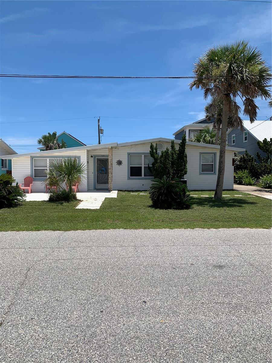 Rare opportunity to own a fully licensed grandfathered vacation rental in Flagler Beach - licenses of this are no longer available, making this property unique. This is a turnkey, two-bedroom, one bath Coastal cottage being sold fully furnished, complete with appliances, decor, and established rental reservations. Inside offers a Bright and inviting Coastal  with all tile floors throughout. Spacious Florida room extending the living area. Go outside and enjoy the screened in back porch, perfect to enjoy your morning cup of coffee or enjoy evening breezes. Fully fenced in  backyard that provides privacy and space for pets. A detached one car garage in rear for convenience and added storage options. Whether used as an investment property or your own personal retreat, this property combines charm, location, and scarcity in one of the exceptional offering.