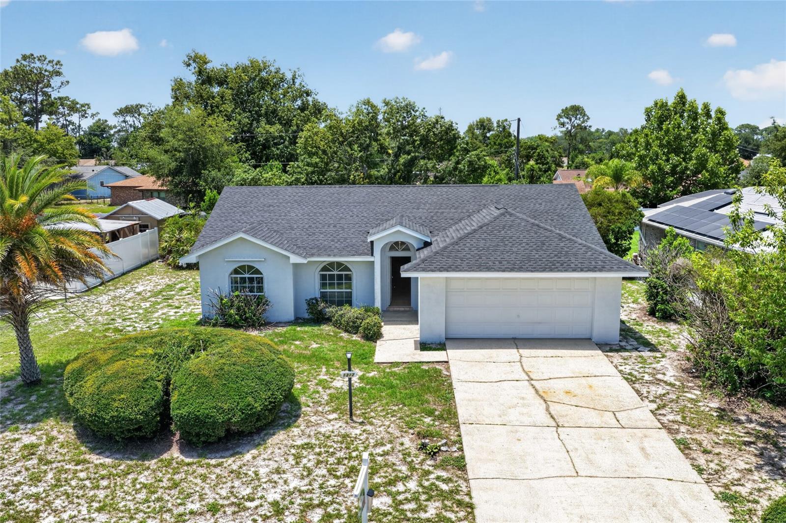 NEW ROOF, NEW LUXURY VINYL PLANK FLOORING THROUGHOUT, NEW KITCHEN, AND UPDATED BATHROOMS! This beautifully renovated 3-bedroom, 2-bath home in the heart of Deltona is truly move-in ready. Step inside to discover stylish new luxury vinyl flooring flowing throughout the entire home, creating a fresh, modern look and feel. The completely remodeled kitchen serves as the features updated cabinetry, contemporary finishes, and plenty of space for cooking, gathering, and entertaining. Both bathrooms have been tastefully updated with modern touches. Additional improvements include a recently pumped septic system, providing added peace of mind for the new owner. Conveniently located with easy access to I-4, this home offers the perfect combination of quiet neighborhood living and easy access to Orlando, Daytona Beach, shopping, dining, and all that Central Florida has. Whether you're a first-time homebuyer, downsizing, or looking for a great investment opportunity, this Deltona gem is one you won't want to miss. Schedule your private showing today!