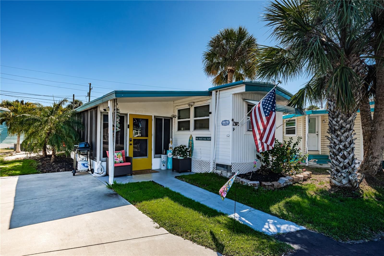 Enjoy relaxed coastal living in this beautifully remodeled 1-bedroom, 1-bath home located in a welcoming 55+ community where you OWN THE LAND with LOW HOA FEES of only $250.00. This move-in-ready home blends modern upgrades with breezy Florida charm, just minutes from everything you love. Step inside to a bright, inviting family room with fresh coastal-inspired feel and light and bright paint. The updated kitchen features newer appliances, modern finishes, and plenty of storage—perfect for everyday cooking or entertaining. New luxury vinyl flooring flows seamlessly throughout the home. The large primary bedroom offers three closets, giving you exceptional storage space rarely found in similar homes. The fully remodeled bathroom showcases an oversized tiled shower, contemporary fixtures, and a clean, modern design. A spacious Florida room expands your living area with dedicated lounging space and an entertaining zone complete with a bar setup. Outside, the beach-like backyard complete with sand creates a peaceful retreat for happy hour sunsets and the shed adds even more storage convenience. Enjoy hot days at the spacious pool and fun get-togethers at the clubhouse.
Located just 10 minutes from our award-winning beaches, Target, the VA Hospital, shopping, restaurants, movie theaters, gyms, and with quick access to the Pinellas Trail, this home offers the perfect blend of comfort, convenience, and coastal lifestyle.