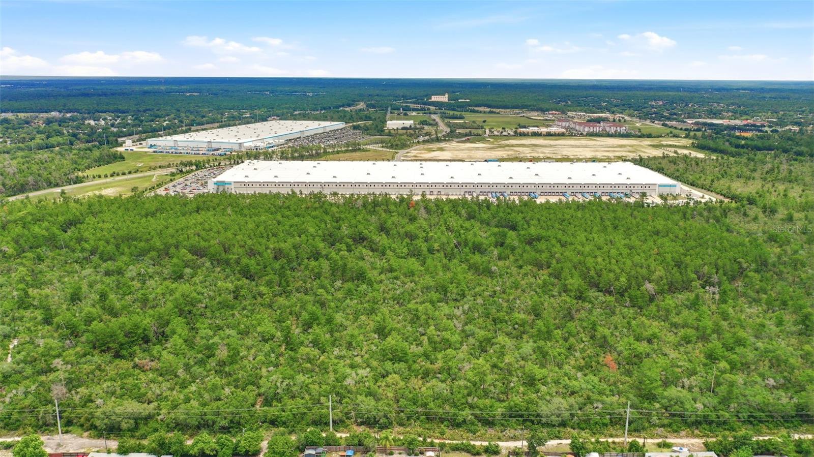 Prime Location: 1.44-acre vacant land parcel located in Deltona’s high-growth I-4 corridor. This site offers a flexible industrial footprint ideal for long-term strategic land hold or future development, in an area experiencing steady absorption driven by logistics, healthcare, and residential expansion. Deltona is the largest city in Volusia County and continues to benefit from strong population growth and its strategic positioning between Orlando and Daytona Beach.

Positioned within a rapidly expanding employment and logistics hub anchored by Amazon operations (approximately 500 employees), Synergy at Normandy, Deltona Village, and ongoing industrial and retail development, this parcel sits in the path of sustained regional growth. Planned SunRail expansion further enhances long-term connectivity, accessibility, and workforce mobility.

Located minutes from I-4, Howland Boulevard, Halifax Health Medical Center, and Halifax Crossings Medical Village, the property benefits from immediate access to major transportation corridors, employment centers, and essential regional infrastructure.

Can be acquired individually or as part of a larger multi-parcel portfolio opportunity. Contact for more details