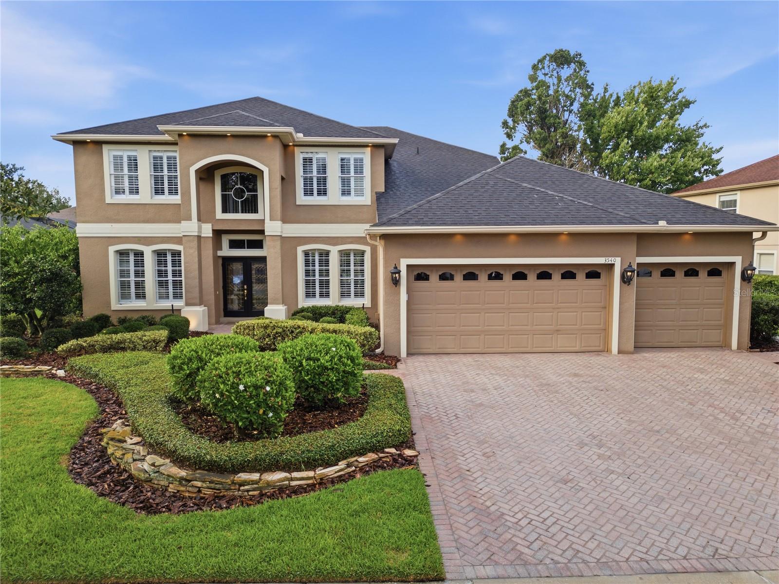 Welcome to this exceptional 4-bedroom, 3-bath home with a dedicated office easily convertible to a 5th bedroom in the highly sought-after Live Oak Reserve community. Offering 3,592 square feet of thoughtfully designed living space, this impressive two-story residence with a 3-car garage seamlessly blends elegance, comfort, and outstanding indoor-outdoor living.

Designed for both everyday living and entertaining, the home features a spacious, open layout with refined finishes and abundant natural light throughout.  From the moment you step inside, you’ll appreciate the soaring ceilings, abundant natural light, plantation shutters throughout, and a highly functional floor plan designed for both everyday living and entertaining. The extended first-floor primary suite provides a private retreat, while the spacious living and dining areas allow plenty of room for gathering with family and friends.

The beautifully appointed kitchen features granite countertops, stunning elongated cherry wood cabinetry, stainless steel appliances, and both under-cabinet and over-cabinet low-voltage lighting that creates a warm ambiance in the evenings. The adjacent family room is equipped with four surround-sound speakers, and automatic stair lighting illuminates your path upstairs with both style and convenience.

The second floor offers three spacious bedrooms, a full bath, and an expansive media room, pre-wired for surround sound and pre-plumbed for a wet bar or kitchenette. This versatile space offers endless possibilities and can easily be enclosed to create a private in-law suite, guest retreat, or multi-generational living area.

Step outside and discover your own private resort. Almost 2800 square feet of travertine hardscaping surrounds a stunning custom saltwater pool and expansive spa, creating an unforgettable outdoor living experience. The space has been thoughtfully designed for future enhancements with places for a pergola and a summer kitchen. This home is equipped with permanent soffit lighting, allowing for effortless seasonal ambience while enhancing year-round beauty and curb appeal.

Additional upgrades include mature landscaping, extensive outdoor enhancements, and a desirable 3-car garage, all situated on a premium homesite within one of Seminole County’s most sought-after communities.  This prime location offers exceptional access to Oviedo's top-rated A-ranked public schools as well as premier private schools.  

Residents of Live Oak Reserve enjoy an exceptional amenity package featuring a resort-style community pool with water slides, tennis courts, pickleball courts, basketball courts, a fitness center, playgrounds, and miles of sidewalks perfect for walking, running, biking, and connecting with neighbors.

Ideally located near A-rated Seminole County schools, shopping, dining, and major commuter routes, this home offers the best of Central Florida living—just approximately 45 minutes from both world-famous theme parks and Florida’s beautiful beaches. This is a rare opportunity to enjoy luxury, convenience, and an unparalleled sense of community all in one remarkable home.