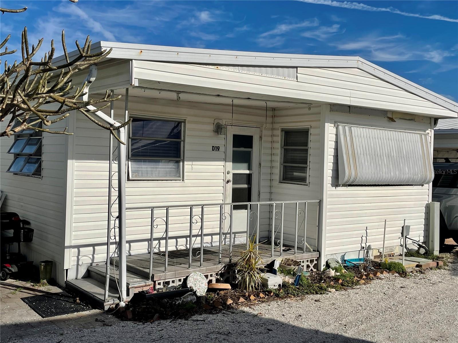 FANTASTIC OPPORTUNITY to own a home in a beach-to-bay community.  Gulfshore of Longboat Key has it all -- private, pristine sand beach, on the Gulf of Mexico, a marina (needs to be repaired) on Sarasota Bay, large community pool, clubhouse with a commercial kitchen, a well-maintained campus and very reasonable HOA fees. Truly, Gulfshore is a remnant of Old Florida that is just six miles from the world-famous St. Armand’s Circle. This home features a living room, separate kitchen, dining room and two bedrooms. This unit was significantly impacted by the two hurricanes in late September and early October 2024.  This home will require a complete remodel.  Thus, the price has been reduced to the value of the land.  The marina is in the process of being rebuilt.  This unit also has parking for two cars and an outside shower/bathroom (needs to be remodeled) that is perfect for when you return from the beach. Gulfshore does not permit rentals or pets. This home offers the perfect opportunity to live in paradise at a very affordable price and in a home that you designed.