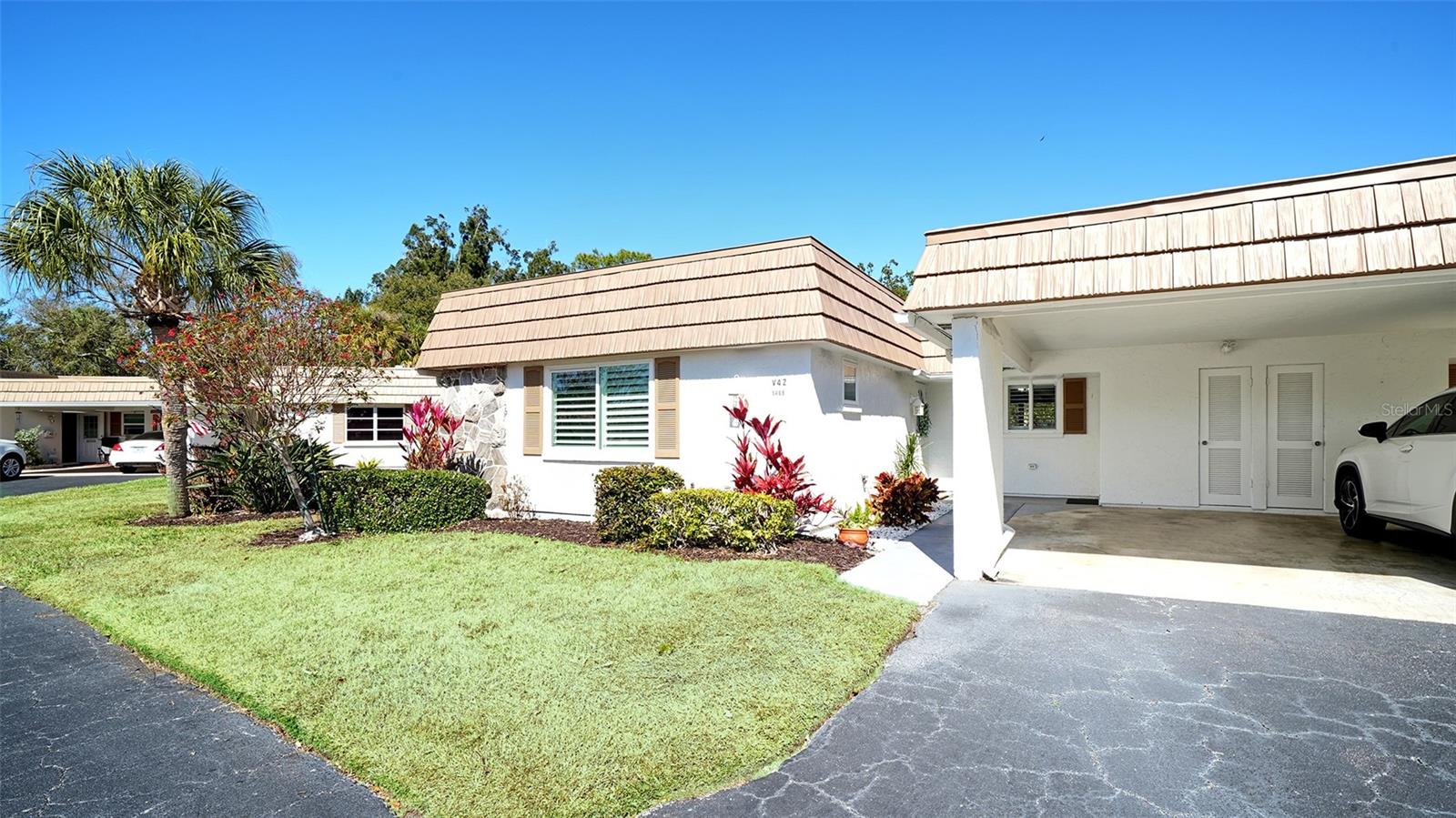 MOTIVATED SELLERS — BRING OFFERS!  
A rare chance to own a beautifully updated villa in Strathmore Riverside, one of Sarasota’s most desirable 55+ waterfront communities with direct Gulf access via Phillippi Creek. Just 1.9 miles to the Siesta Key South Bridge, you’re minutes from world-famous beaches, dining, and the beloved Detwiler’s Farm Market.   Step inside this light, bright, and stylishly renovated 2-bed, 2-bath villa featuring a smart floor plan and luxury vinyl plank flooring throughout. The modern kitchen shines with quartz countertops, wood cabinetry, stainless steel appliances, and a generous entertaining island that anchors the space.  Enjoy the serenity of no rear neighbors and peaceful open green-space views—your own private oasis. Both bathrooms are tastefully updated, and plantation shutters add a polished, coastal feel. Additional perks include updated windows, a covered carport, attached laundry room, and extra storage. Seller will provide a homeowner's warranty effective the day of closing at no additional cost to buyers; for one year.    Strathmore Riverside offers a true resort-style lifestyle with a heated pool, clubhouse, fitness center, sauna, and a full calendar of social activities. Easy access to Sarasota's artistic events such as symphony, ballet, opera and Broadway shows.   Boat slips are available for $1344.00/year, (first come first served) making this a dream for boating enthusiasts. Monthly dues include basic cable, water, trash, and sewer, ensuring easy, low-maintenance living.   This is the Florida lifestyle buyers are searching for—don’t let it slip away. Call to see it today!!!