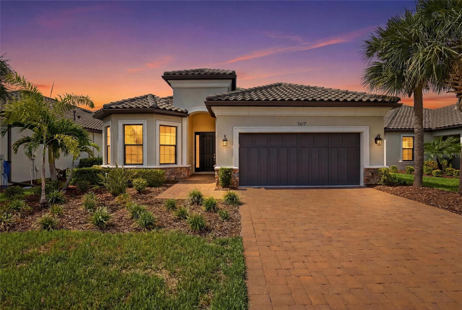 Located in the highly sought after gated community of Bellacina by Casey Key, this exceptional Lazio model showcases a beautifully designed open concept floor plan offering 3 bedrooms, 3 bathrooms, a den, and a 2 car garage, complemented by an interlocking paver driveway. Situated on a quiet street with no rear neighbors, this home offers one of the most private settings in the community. The desirable north facing front exposure and south facing backyard provide optimal sunlight for the heated saltwater pool throughout the day. Natural light flows effortlessly throughout the spacious interior, enhanced by high ceilings, a tray ceiling with ceiling fan in the living area, eight foot doors, and recessed lighting throughout.

The upgraded gourmet kitchen features stainless steel GE appliances, a natural gas stove, an oversized island with breakfast bar, a pantry, abundant cabinetry, and generous counter space, creating an ideal space for both everyday living and entertaining.

The spacious primary suite offers a beautiful bay window that creates a bright sitting area filled with natural light. The luxurious primary bath includes dual sinks with a makeup vanity, a large glass enclosed shower, and an oversized walk in closet.

The private guest suite includes its own ensuite bath with a glass enclosed shower, while the second guest bedroom also features a charming bay window, with both guest bedrooms offering spacious closets. The third bathroom includes a shower and tub combination, providing flexibility for guests and daily living. A versatile den completes the interior and may serve as a home office, study, media room, or potential fourth bedroom. The laundry room features a utility sink and convenient direct access to the garage, adding everyday functionality and ease of use. The garage features an epoxy coated floor, adding a clean, durable, and finished look with easy maintenance.

Step outside to a private outdoor retreat featuring a heated saltwater pool and an extended screened paver lanai with a rough in for an outdoor kitchen, designed for effortless indoor outdoor living. Hurricane shutters provide added peace of mind with quick and convenient storm protection and enhanced security during inclement weather.

This community offers a maintenance free lifestyle with HOA fees covering home landscape maintenance, community landscaping, parks, roadways, gated entry operations, property management services, and access to a full time onsite manager. Residents enjoy resort style amenities including a clubhouse, fitness center, resort pool and spa, pickleball courts, tennis court, bocce ball courts, dog parks, a fire pit, event center, catering kitchen, outdoor gathering spaces, and direct access to the Legacy Trail for walking, biking, and jogging.

Ideally situated between Venice and Sarasota, this exceptional home offers the perfect blend of privacy, luxury, and the sought-after Florida lifestyle. Enjoy convenient access to everyday essentials, with grocery stores, shopping, and dining just 2 miles away, beautiful Gulf beaches only 3.5 miles from your doorstep, and the charm of downtown Venice just 5 miles away, along with nearby golf courses, entertainment, and countless opportunities for recreation and relaxation, you'll enjoy easy access to everything that makes Florida living so desirable. Schedule your private showing today and experience the lifestyle this exceptional home has to offer.