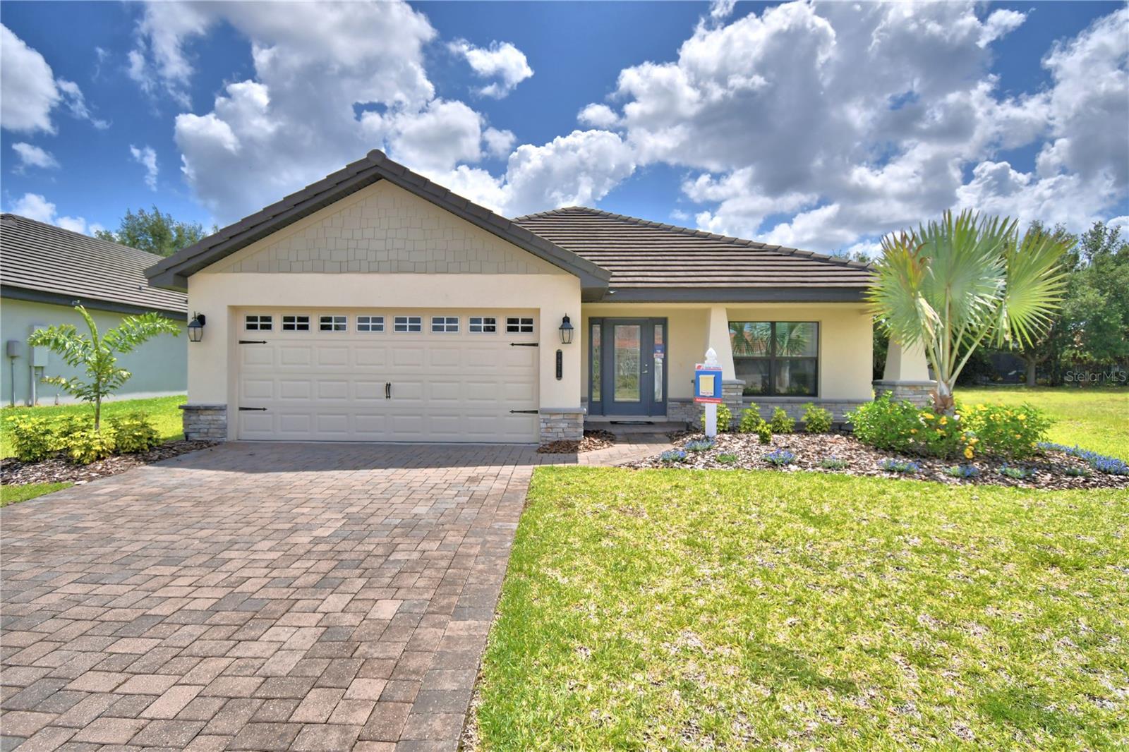 This 2200 square foot Home is a stunning home design that offers a perfect balance of style and functionality. With 4 bedrooms and 3 baths, this home provides ample space for comfortable living. The open-concept layout seamlessly connects the kitchen, dining area, and living room, creating a spacious and inviting atmosphere. The modern kitchen is equipped with high-quality appliances, a large counter, and plenty of storage space in the pantry and cabinets. The bedrooms are well-appointed and provide privacy and relaxation for family members. The maters suite is located in the back of the home to ensure privacy. The additional three bedrooms are placed on the opposite side of the home and are versatile to accommodate family and guests or a home office. The lanai in the back extends your living space outdoors and provides the perfect place to host gatherings or simply enjoy the weather. With its thoughtful design and attention to detail this is a remarkable choice for those seeking a beautiful and functional home. CUSTOM EXTERIOR includes 30-year mildew resistant dimensional shingles Termite treated with Bora care-renewable after 1st year, Low maintenance aluminum fascia and vinyl soffit Professionally landscaped yard, Insulated, Decorative coach lights on garage and front entry. EXCEPTIONAL INTERIOR includes Stain resistant designer carpet, Recessed LED lighting in kitchen & family room, tile flooring in kitchen, laundry, foyer, and bathrooms. Prewired for ceiling fan and 4 LED discs in family room, Pre-wiring for ceiling fans in all bedrooms with dual switches, LED Disc, with rocker switches in all bedrooms. Generous walk in closets with ventilated shelving, 6 TV/Cable jacks or phone jacks, Vaulted ceilings, Wood Window Sills. Indoor laundry room with kitchen entry and garage entry. 5 1/4 baseboards throughout,5 panel smooth finish interior doors with brushed nickel, lever door handles. Garage door opener prewire, Two tone Interior paint package, Custom cased openings, GOURMET KITCHEN includes Designer recessed lighting Custom wood cabinets with adjustable shelves Included 36” upper cabinets with crown molding and custom bump out Stainless steel double bowl sink. Single lever brushed nickel faucet with pull out sprayer, Energy efficient multi-cycle dishwasher, Smooth top stove with self-cleaning feature, Space saver microwave above the range, Ice maker connection. Spacious pantry with ventilated shelving. LUXURY BATH AREA includes Easy care garden tub/shower combination in master bath, Elongated toilets, pull out drawers in most cabinets, Dual rectangle sinks, upgraded brushed nickel faucets ENERGY EFFICIENCY includes Double pane insulated windows with tilt-in sash for easy cleaning, Energy efficient Whirlpool appliance package, R-38 ceiling insulation, Continuous soffit attic ventilation, Off ridge roof ventilation,15 SEER Heat Pump with digital thermostat Low volume flush toilets.