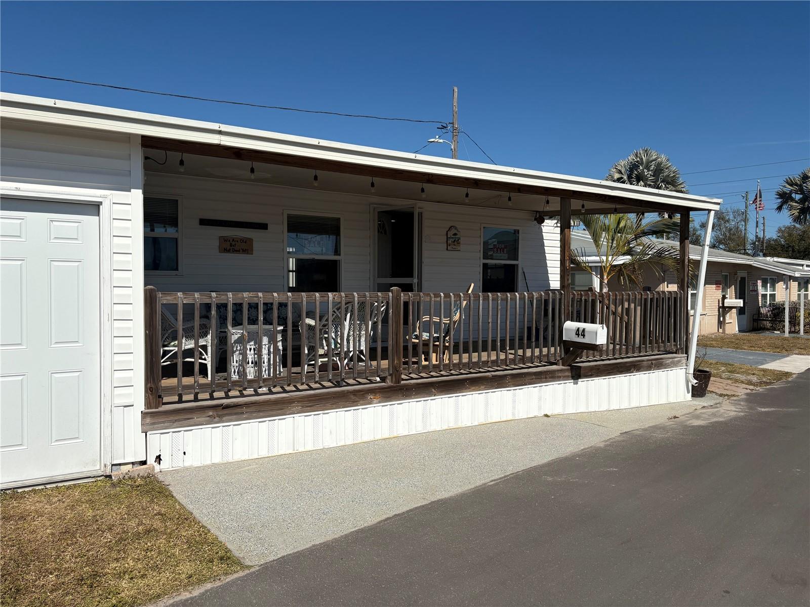 LOCATION, LOCATION, LOCATION!!! Completely renovated, meticulously remodeled, and fully furnished, this stunning 2-bedroom OR 1-bedroom + flex space, 1-bath home is located in the desirable Oasis Mobile Home Park, a 55+ co-op community offering low-maintenance Florida living at its finest. Move-In Ready!!! This home has been freshly painted and features new flooring throughout, along with new lighting in both the kitchen and bathroom (and what a bathroom - totally spa-like!!!). Presented in excellent condition, the interior offers a clean, bright, and fully furnished environment, thoughtfully designed for easy, comfortable living. The updated eat-in kitchen provides ample cabinetry and a welcoming layout, while the engaging living room is highlighted by abundant windows on both sides, filling the space with natural light. The modern open floor plan flows beautifully and enhances the home’s airy feel. Enjoy outdoor living year-round on the impressive 410 sq ft covered porch, perfect for relaxing or entertaining. The back-yard space is perfect for gsrdening or relaxing in the sun! Additional features include an attached shop with washer and dryer and generous storage, plus a rear shed for even more storage space. The low HOA fee of just $143/month covers water, sewer, garbage, and lawn service, making this an affordable and worry-free option. Seller is proviuding the Co-op fee of $19,000 included in the price!!! Ideally located within minutes from Ind Rocks Beach, Clearwater Beach and Madeira Beach. You’ll be just minutes from some of Pinellas' finest golf courses, as well as restaurants, parks, and endless activities. Plus, enjoy walking distance to Largo Mall, featuring nearly every shopping option imaginable. Whether you’re looking for a full-time residence or the perfect seasonal getaway, this move-in-ready home truly has it all and is priced to sell. Schedule your private showing today—this one won’t last!