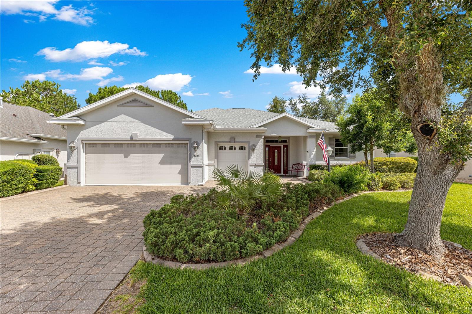 This spacious, pretty home is in the much sought after 55+ community of Candler Hills/On Top of the World right ON the Golf Course!  When pulling up to the home you will immediately see the mature landscaping with concrete edging along with the paver drive and walkway. There is an oversized 2 car garage with golf cart garage. Once inside, neutral oversized tile set on the diagonal is in main living areas of this open concept home. There is an ample sized formal dining room that flows into the spacious living room and kitchen area. A triple slider leads to the screened room with beautiful views of golf course. The kitchen features plenty of cabinet space with pantry and corian counter tops. Stainless steel appliances with a gas range and a cozy nook for the morning coffee with great, private views. The king sized primary bedroom includes a tray ceiling and look at the size of that walk-in closet with a window for natural light! Primary bath has a double sink vanity, walk-in tiled shower with a pretty border and linen closet. There are two nicely sized guest rooms, one currently used as an office. The guest bath has a tub/shower combo. New roof in Oct. 2025. A large garage with space for cars, golf cart and a workshop depending on your needs. Call for your appointment to view today!