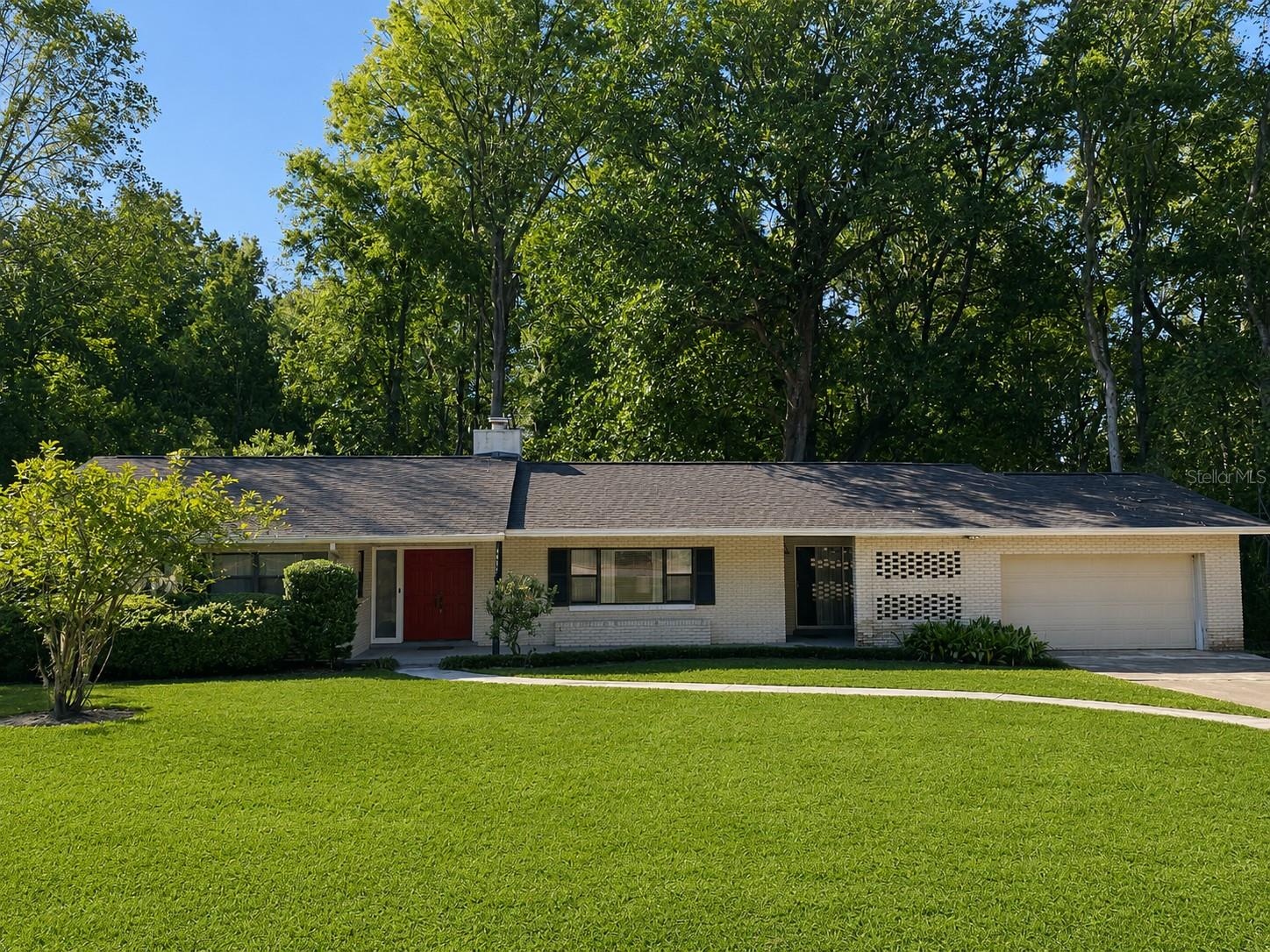 This is the ONE!  Nearly 3/4 of an acre lot in the heart of Gainesville and an amazing, remodeled, solid block, NO HOA single family home with 4 bedrooms and 2.5 bathrooms.  Huge kitchen with new countertops and a large island opens into a family room with a new electric fireplace. Large bedrooms with new flooring and freshly painted inside and out.  The front of the home features a large circular driveway and 2 car garage.  And the back... well the back is simply one of a kind.  A meandering creek towards the back of the lot and a fire pit to take it all in.  Plenty of room and privacy in a spot that you don't expect it.  You are less than 1/4 mile to NW 39th and NW 43 intersection.  Less than 1 mile to The Fresh Market and Publix, About 3.5 miles to UF too.  Gainesville Airport is 15 minutes away.  You can literally get anywhere in town in less than 15 minutes but live in peace and comfort.