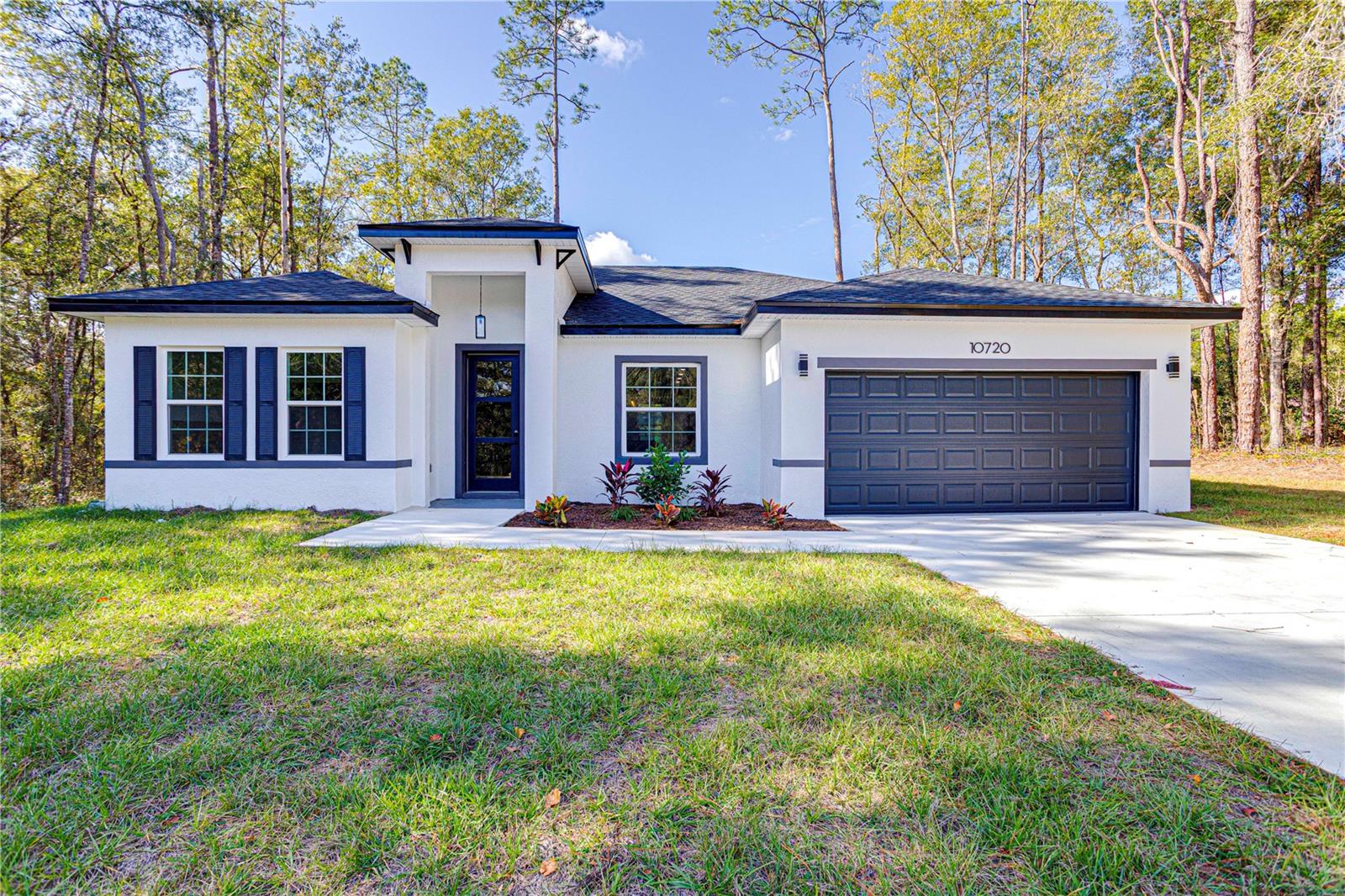 Beautiful new construction 3-bedroom, 2-bathroom home in Citrus Springs featuring approximately 1,832 sq ft of modern living space and a 2-car garage. This home stands out with upgraded modern wood accent paneling throughout every room, adding a luxurious contemporary feel rarely found in rental homes.

The open-concept layout offers high ceilings, recessed lighting, luxury vinyl plank flooring, and a designer kitchen with quartz countertops, stainless steel appliances, a large island, and walk-in pantry. The spacious primary suite includes a walk-in closet, dual vanities, and a walk-in shower.

Located on a private lot near shopping, dining, schools, and major roadways. Lawn maintenance included. Move-in ready and available now.