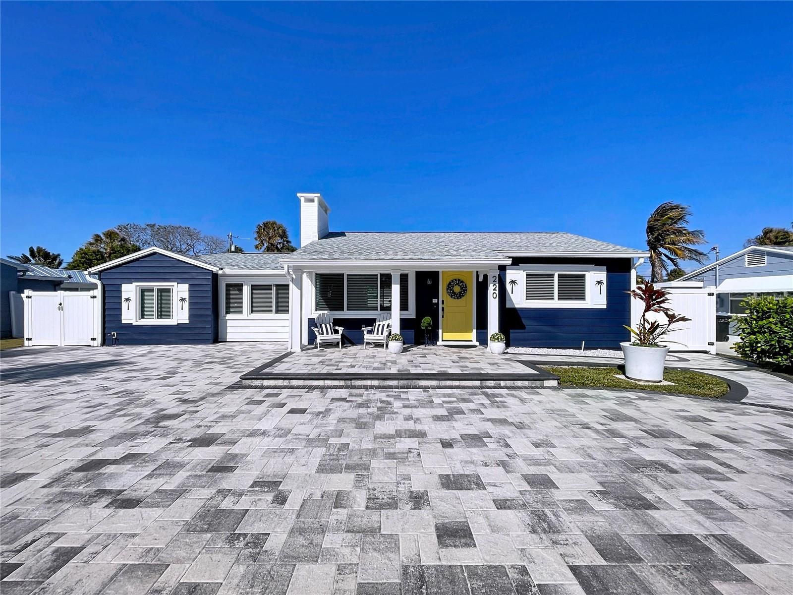 The Blue Beach Cottage awaits you! Nothing has been left to the imagination and features upgrades exclusive to custom builds. Explore and revel in this extraordinary treasure. Enter into a spacious open concept living area, the adjacent kitchen welcomes you with glowing natural light. The kitchen and indoor laundry sport new upgraded and matching appliances while custom built-ins and shelving offer ample storage space and opportunities to display and showcase your own personal style. The primary suite is outfitted with a walk-in closet, private bath and additional make-up/styling nook. Two spacious guest bedrooms provide individual climate controls and closet systems. Nestled perfectly between the living area and laundry is a family/game room equipped with a beverage center and a custom built fifteen-foot banquette with storage. A water softener and a reverse osmosis purifier for drinking water make bottled water obsolete. Multiple entry points lead to a spacious backyard framed by a grand wrap-around patio that is ideal for grilling and entertaining, a chipping and putting green add to the backyard fun. An outdoor shower is ideally located next to a beach gear storage unit. The Blue Beach Cottage, in the Belle Vista neighborhood, is a mere 400 step walk to the sugary sands of St. Pete Beach. A private parking area for Belle Vista residents is also available at the intersection of 44th Ave and Gulf Blvd. Positioned conveniently between Pass-a-Grille, the Don and the shops of Corey Ave, the Blue Beach Cottage is a jewel seldom found. This home is more than just a turn-key gem it is unique with its custom upgrades and add-ons that will fit all tastes and styles. There will be no need for any remodel or reno work; any and everything one can conceive has been realized. This home is equipped with new central HVAC system and mini split units.  Hurricane windows and custom shades were added in 2025. A new water heater, new plumbing, an in-ground irrigation system, outdoor lighting and enhanced electrical system added in 2025 and 2026 position this home to rival any new build.