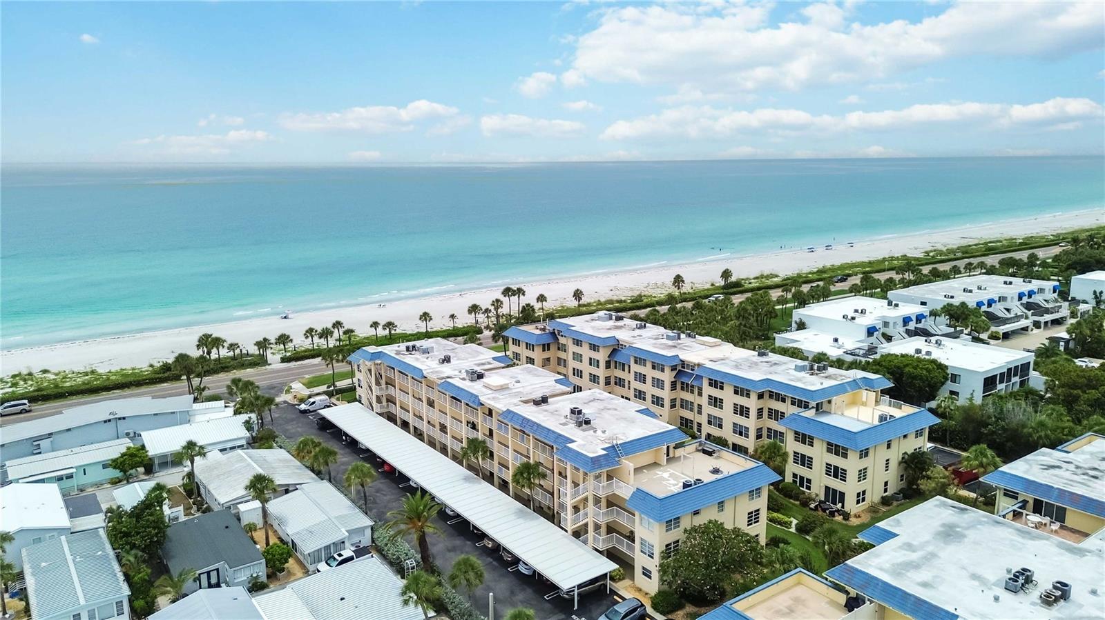Welcome to coastal living at its finest in this beautifully renovated 1-bedroom, 1-bath condo at Beach Harbor Club on coveted Longboat Key. Perfectly positioned adjacent to the beach, this second-story retreat offers a peek-a-boo view of the sparkling Gulf and 761 square feet of stylish, light-filled comfort.

Step inside to discover a fully updated interior featuring impact windows, a new AC system, and modern finishes throughout. Every detail has been thoughtfully considered to deliver effortless island living. The building offers convenient elevator access, plus a wealth of amenities designed for relaxation and recreation.

This vibrant community stretches from beach to bay, granting you deeded beach access and a rooftop deck where unforgettable sunsets await. Cool off in the heated pool, unwind at the tiki bar, or gather with neighbors in the clubhouse. Outdoor enthusiasts will love the kayak and canoe launch, while boat slips are available first-come, first-serve for $700/year. Additional perks include a fitness center, laundry facility, bike storage, storage locker, wood shop, and on-site management.

Condo fees thoughtfully cover TV, internet, and water for added peace of mind.

Beyond your doorstep, indulge in the best of the region. Savor waterfront dining at Dry Dock Waterfront Grill, shop at nearby Publix, or explore the boutiques of St. Armands Circle. Anna Maria Island's charm is just a short drive away.

Discover your slice of paradise—schedule your private showing today and embrace the Longboat Key lifestyle.