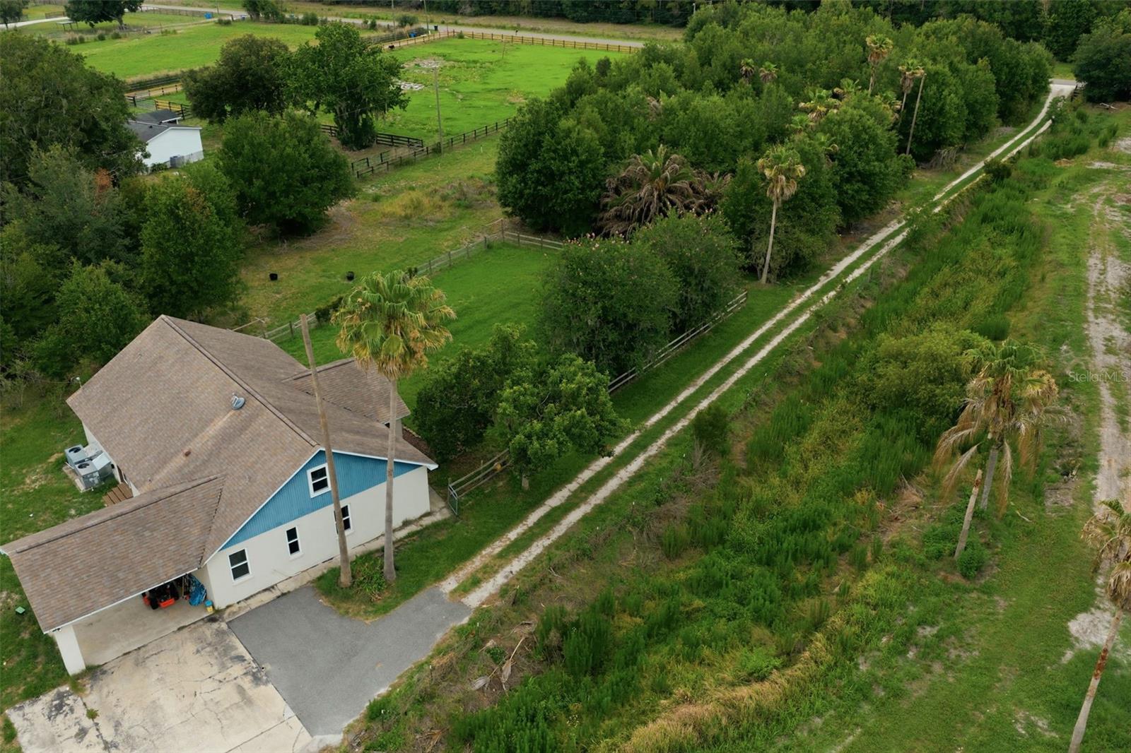 One or more photo(s) has been virtually staged. Finding a 5-bedroom, 3-bath home on nearly 5 acres under $600,000 is difficult. Finding one with this level of privacy, usable land, and agricultural zoning is even rarer.  Situated on 4.61 acres in Plant City's rural countryside, this nearly 2,900-square-foot (personal Oasis) residence was formerly utilized as an ornamental tree farm and showcases rows of mature trees that create a shaded canopy and natural sense of seclusion rarely found in today's market. An oval-shaped pond area further enhances the landscape and contributes to the property's unique outdoor setting.Why drive hours to escape the city when the adventure starts in your own front yard?Nearly five acres provide room to explore, ride, camp, gather, and enjoy the outdoors in a way few residential properties can match. Park an RV beneath the mature tree canopy, enjoy evenings under the stars, or simply appreciate the feeling of having your own private retreat. Inside, the split-bedroom floor plan offers exceptional flexibility. The oversized primary suite serves as a private retreat, while five bedrooms and three full bathrooms provide room for guests, home offices, hobbies, or multi-generational living. Recent improvements include a 2016 roof, two newer AC units, and energy-efficient double-pane windows. Agriculturally zoned, the property offers flexibility for a variety of rural and agricultural pursuits. The current owner is not utilizing Florida's Agricultural (Greenbelt) Classification; however, qualifying future owners may wish to explore potential agricultural classification and associated property tax benefits. Buyers should independently verify eligibility requirements with the Hillsborough County Property Appraiser.  Conveniently located with easy access to Tampa, Lakeland, shopping, dining, and major commuter routes, this property offers a rare opportunity to enjoy space, privacy, and the freedom that comes with owning your own slice of Old Florida.