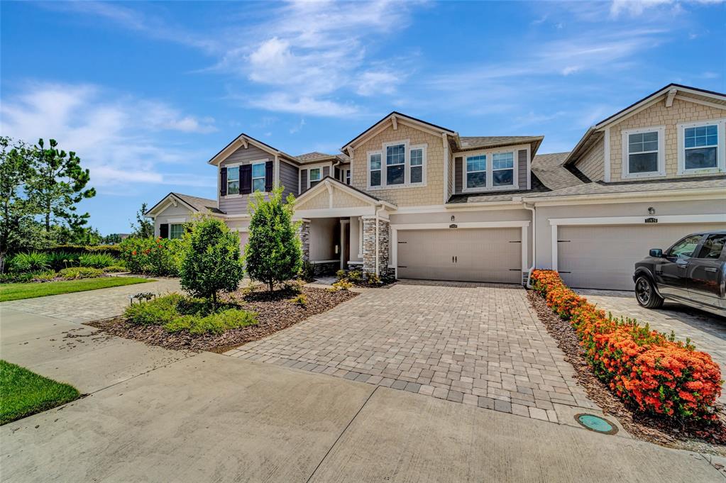 Welcome Home!! This rarely available cul-de-sac Executive townhome is the largest of the Mattamy Homes floor plans in the Harmony subdivision of Lakewood Ranch and this home boasts an open floor plan with plenty of space and loads of upgrades.

The first floor displays lovely "wood-look" porcelain plank tiles throughout, along with a brilliantly stated gourmet kitchen with 42-inch cottage cabinets and crown molding, granite countertops, stainless steel appliances and a perfectly placed center island which allows for plenty of entertaining space directly next to the adjoining breakfast room and extra-large screened in lanai.

The cozy gathering room displays loads of light between the large windows and canned lighting leading upstairs to 3 large bedrooms plus a huge loft which offers so many additional options such as using as a home office, playroom or even a 4th bedroom.

Owners Suite boasts a tray ceiling with canned lighting and large windows, walk-in closet and connecting Owner's Suite bathroom, complete with granite double bowl vanity plus a large oval soaker tub along with a separate shower.

Conveniently located 2nd floor laundry room offers plenty of room with shelving and an upgraded oversized washer and dryer. This 3 bedroom 2.5 baths with loft Executive townhome offers a fabulous location with proximity to everyday conveniences, top educational opportunities, shopping, dining, active recreation, natural wonders, and plenty to see and do. Harmony is a short distance to a new shopping center, The Green at Lakewood Ranch, across from the CORE employment center, and close to Lakewood Ranch’s Town Centers. With Lakewood Ranch High School only 1.5 miles away and loads of shopping choices such as Winn-Dixie, CVS, Burger Fi, DOGPerfect, Pacific Counter, Spa and nail salons and so much more. Conveniently located less than 5 miles from Interstate 75, this Executive townhome is an easy choice for someone looking for a great location, move-in ready, well-appointed home in a resort style community pool with beach entry and lap lanes, clubhouse with fitness center, a playground and connecting walking trails throughout.