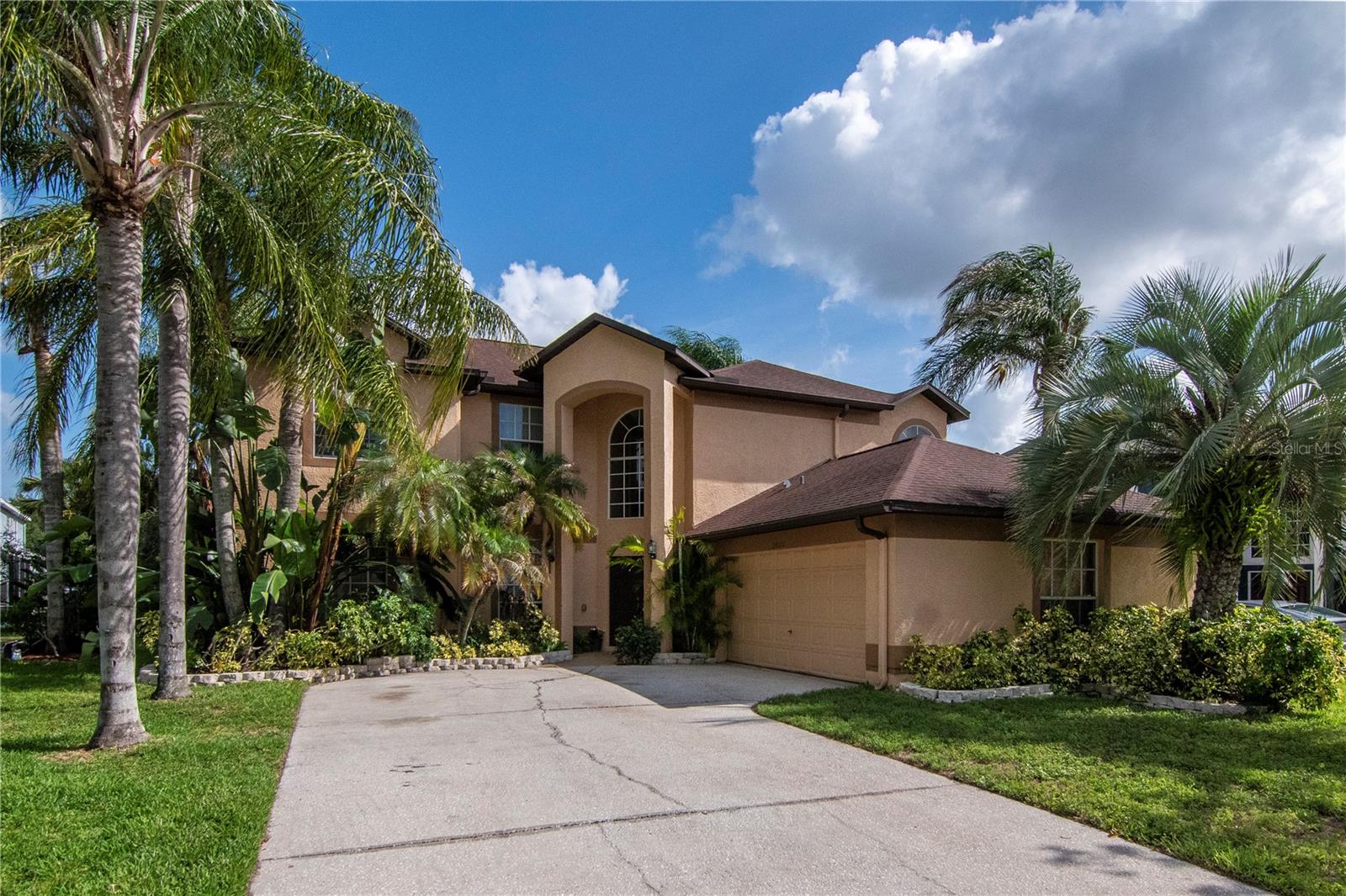 A can't-miss opportunity in Wesley Chapel’s premier Northwood community!
Situated perfectly on a quiet cul-de-sac, this impressive 5-bedroom, 2.5-bathroom home greets you with a grand entry and soaring staircase that sets a stunning tone the moment you step inside. The main floor boasts elegant hardwood floors, sophisticated separate living and dining spaces, a convenient half-bath, and a highly functional downstairs bedroom—perfect for guests, a home office, or a playroom.
At the heart of the home, the kitchen is flooded with beautiful natural light and comes fully equipped with brand-new, sleek black appliances that make the space look incredibly modern and sharp. Just nearby, the dedicated downstairs laundry room includes a highly convenient utility sink along with quality overhead cabinets above the washer and dryer space for excellent extra storage.

Step into the family room and open the 3-piocketed sliding glass doors to reveal an incredible outdoor living setup. The patio runs the full length of the house, leading into a stunning glass-enclosed extended screen room equipped with electrical outlets (currently utilized as an enviable home gym). This sunroom looks out onto a beautifully landscaped, mature backyard complete with a dedicated outdoor play area. 

Head upstairs on brand-new carpeting to find gorgeous luxury vinyl flooring and four additional, generously sized bedrooms. The oversized primary suite is a true sanctuary, complete with a private, tucked-away seating area, a deep garden tub made for soaking, and a separate shower.

Love the outdoors? The extended sunroom is a fitness or relaxation lover's dream (currently utilized as an enviable home gym), opening up to a beautifully landscaped, mature backyard complete with a dedicated outdoor play area.
Location & Lifestyle Bonus: Enjoy the perks of an extremely low HOA fee while living just minutes away from Wesley Chapel’s premier shopping (like the Wiregrass Mall and Premium Outlets), top-tier restaurants, and quick, easy access to the interstate for a seamless commute.
This turnkey property checks every single box for space, style, and convenience. Don't wait—schedule your private showing today and step into your dream home!