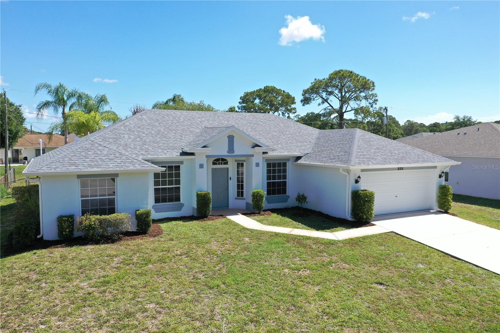 Under contract-accepting backup offers. Virtually Staged. Move-in ready and thoughtfully updated, this bright Palm Bay home delivers major peace-of-mind improvements -- a NEW 2026 ROOF, NEW 2026 HVAC, fresh 2026 interior paint, and brand-new, never-used kitchen appliances. Step through the covered entry into light-filled formal living and dining rooms that open to a spacious great room built for gathering. The kitchen shines with warm oak cabinetry, brand-new stainless appliances, and room for breakfast nook. Generous bedrooms offer true retreat, while two full baths feature a spa-style garden tub and separate glass shower. Enjoy an indoor laundry room (included in sale) washer and dryer, and a two-car garage. Outside, a covered lanai and large concrete deck overlook an expansive fenced backyard framed by mature palms -- room to relax, entertain, and play. Set on a quiet, established street with quick access to I-95, shopping, and the Space Coast's beaches. Nothing to do but unpack -- schedule your private showing today!
