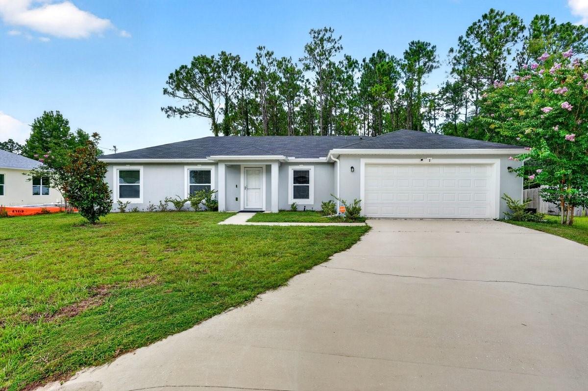 Why wait to build when you can move right into this beautifully maintained 2022-built home in the heart of Palm Coast? This move-in ready 4-bedroom, 2-bathroom home with a 2-car garage offers the perfect combination of modern finishes, an open floor plan, and a spacious backyard--all in one of Palm Coast's fastest-growing communities. Step inside to discover a bright, open-concept layout with soaring vaulted ceilings, luxury vinyl plank flooring throughout the main living areas, and abundant natural light. The spacious kitchen is the centerpiece of the home, featuring rich wood cabinetry, stainless steel appliances, generous counter space, a large breakfast bar, and seamless flow into the dining and living areas--ideal for entertaining or everyday living.

The desirable split-bedroom floor plan provides privacy for the primary suite while offering three additional bedrooms perfect for family, guests, a home office, or hobby space. The spacious primary retreat includes a walk-in closet and an ensuite bathroom with dual vanities and a walk-in shower.

Enjoy indoor-outdoor Florida living with sliding glass doors leading to the oversized backyard, offering plenty of room to add a pool, create your dream outdoor entertaining space, or simply enjoy the peaceful setting. The two-car garage provides ample storage, while the inside laundry room adds everyday convenience.

Built in 2022, this home offers the peace of mind that comes with newer construction while eliminating the wait, uncertainty, and additional costs often associated with building new.

Conveniently located near shopping, restaurants, parks, walking and biking trails, schools, medical facilities, golf courses, and just a short drive to Flagler Beach and the Atlantic Ocean. Easy access to US-1 and I-95 makes commuting to Daytona Beach, St. Augustine, and Jacksonville simple.

Whether you're searching for your primary residence, a Florida retirement home, or an investment property, this Palm Coast home checks every box with modern construction, functional living spaces, and an unbeatable location.

Don't miss your opportunity to own this move-in ready Palm Coast home--schedule your private showing today!