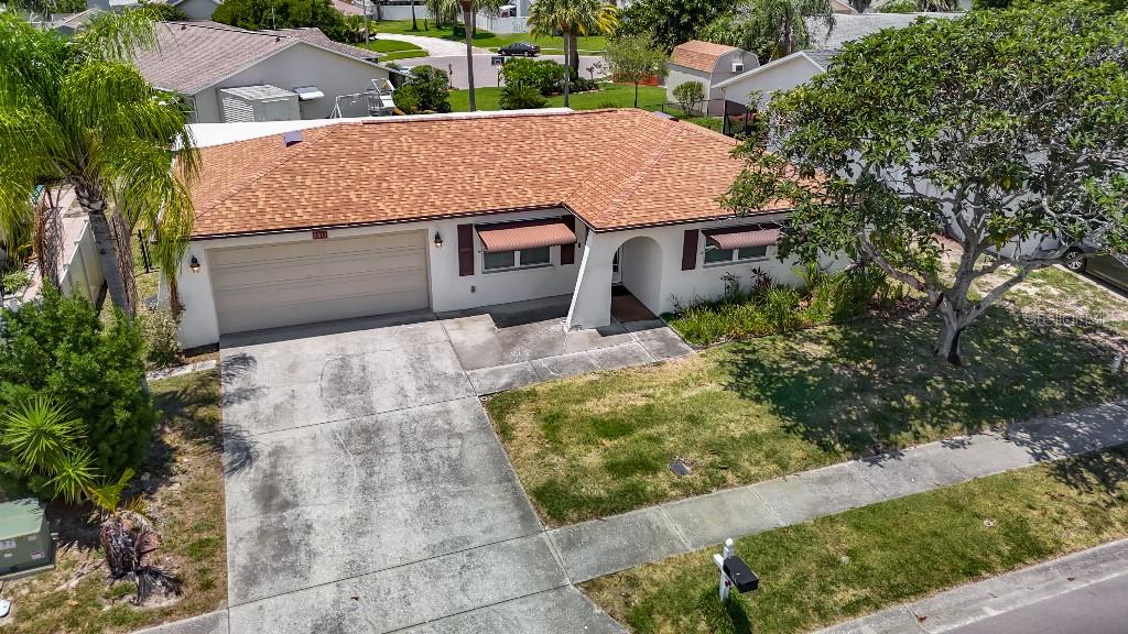 WELCOME HOME to your new 3-bedroom 2-bathroom home! Awesome location. Minutes from everything including Chasco Elementary/Middle School which is walking distance away. The home has vaulted ceilings. The home has had many upgrades including – Roof 6/2022, A/C 4/2018 service regularly, Water Heater 2/2024, Impact Hurricane windows 6/2024, Appliances 2020, Water Softener 1/2023, Wi-Fi thermostat and garage door opener, all tile floors throughout, all electrical outlets and switches replaced 6/2023, R-38 insulation blown in 7/2022, solid core interior bedroom and bathroom doors, clean deep well irrigation system with newer timer box, 4 zone, large back yard with view of pond. And more upgrades. It’s a MUST-SEE HOME, VERY WELL CARED FOR HOME!
