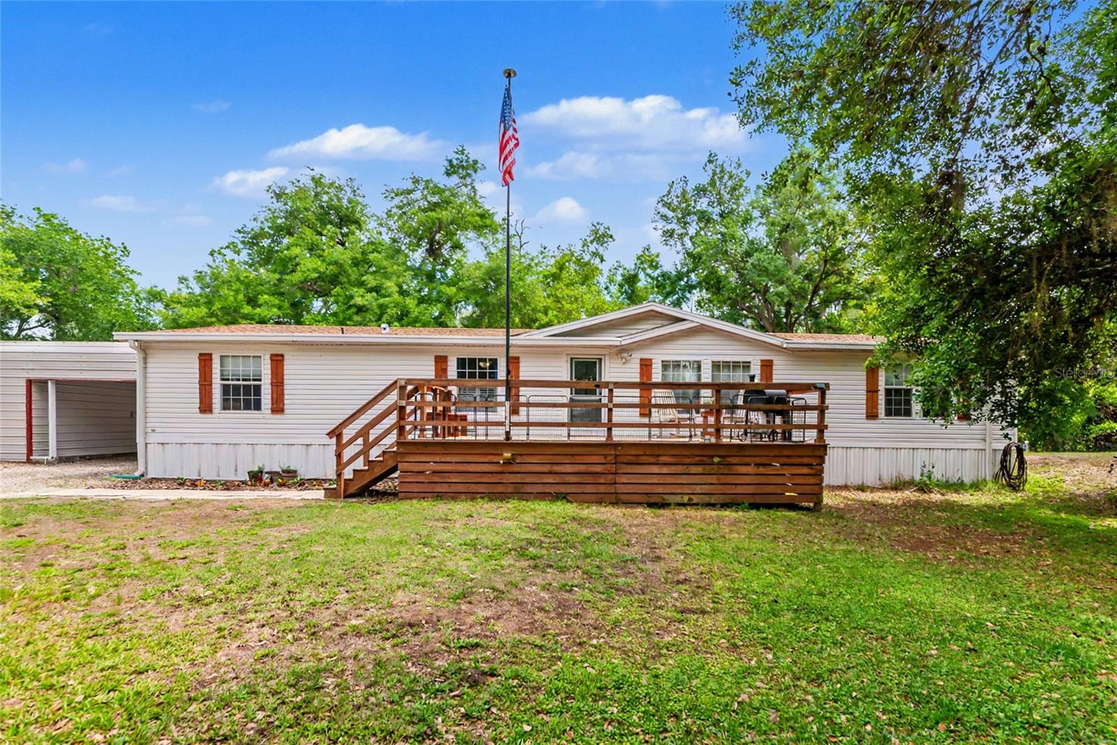 VA ASSUMABLE LOAN AT 2.6% POSSIBLE (ASK FOR DETAILS IF INTERESTED) 
Welcome to easy Florida living with room to spread out, build your dreams, and enjoy the freedom of no deed restrictions holding you back. This spacious 2006 manufactured home offers 3 bedrooms, 2 renovated bathrooms with new shower from bath fitter, and an impressive 1,957 square feet of comfortable living space, perfect for families, entrepreneurs, remote professionals, hobbyists, or anyone looking for flexibility and functionality. Major updates provide peace of mind, including a NEWER ROOF (2021), NEW A/C SYSTEM (2025), and BRAND NEW HOT WATER HEATER (2026). Inside, you'll find a bright and inviting layout with generous living areas, abundant natural light, and an OVERSIZED KITCHEN that is perfect for cooking, meal prep, entertaining guests, hosting holiday gatherings, or creating memorable family dinners. With plenty of counter space and storage, this kitchen is truly the heart of the home. HOME HAS BEEN PRE INSPECTED AND A CLEAN 4-POINT INSPECTION IS ATTACHED TO THE MLS FOR YOUR REVIEW. Step outside and discover where this property truly shines. With NO DEED RESTRICTIONS and NO HOA, you have the freedom to live, work, and play on your terms. Bring your boat, RV, work trucks, equipment, and all your recreational toys. The impressive 20 x 60 SHOP is a standout feature, offering exceptional flexibility for business owners, remote workers, creatives, and entrepreneurs. Features include:
• 50 amp RV hookup
• Window unit Air conditioned office with internet access, ideal for a home office, online business, consulting space, studio, or private workspace
• Plenty of room for inventory, equipment, projects, storage, or a home-based business
Whether you're running a business from home, managing clients remotely, building a side hustle, or simply wanting a dedicated space separate from the house, this property offers the versatility that today's work from home lifestyle demands.
Additional highlights include a generator transfer switch, making storm season power needs easier to manage. To top it off, the home comes complete with a 2025 washer and dryer set. If you're looking for space, flexibility, freedom, and practical upgrades without the limitations of an HOA, this property delivers exceptional value and endless possibilities for both work and play.