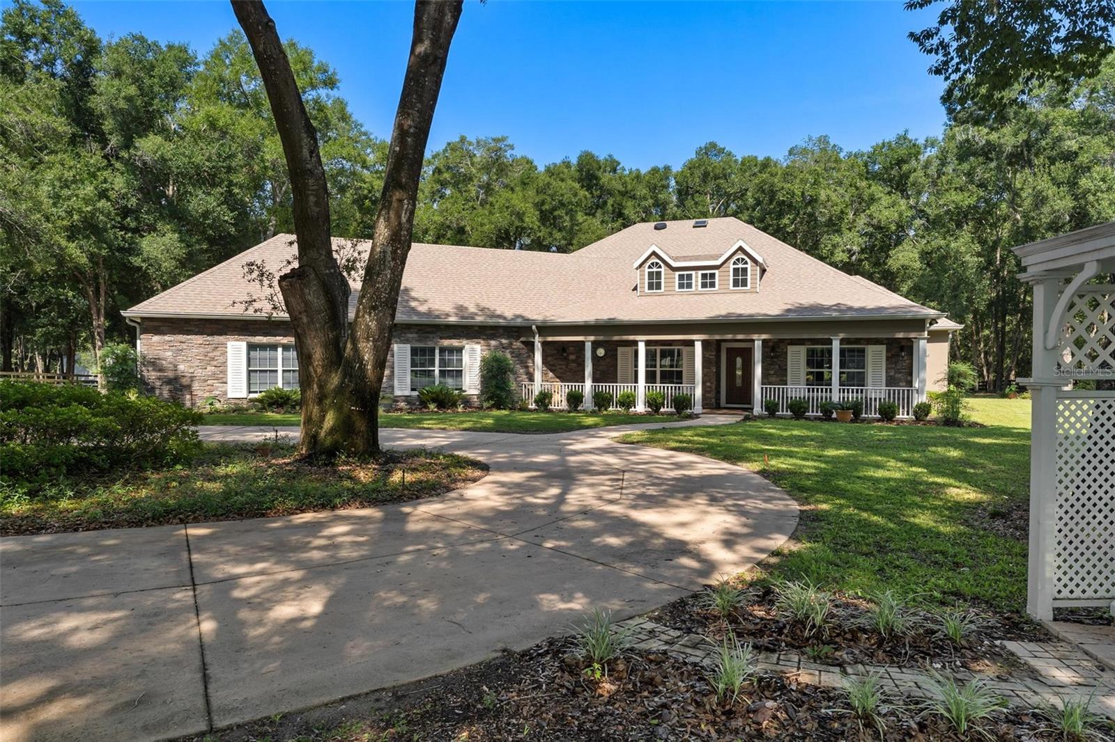 "One or more photos have been virtually staged" SELLER MOTIVATED...BRING ALL REASONABLE OFFERS!! Custom Estate Living on Over 3 Acres – Luxury, Privacy, and Convenience! Welcome to a truly exceptional custom-built estate offering over 3,100 square feet of beautifully crafted living space on 3.14+ acres on a peaceful tree-filled property. Tucked away in a gated community of high-end homes, this one-of-a-kind residence blends elegant craftsmanship, privacy, and convenience in an unbeatable location close to the 429 for easy commuting. From the moment you arrive, the graceful circular driveway and stately presence of the home create a warm and inviting first impression. Situated on a spacious, beautifully wooded lot, the property offers a serene setting with room to breathe while still being just minutes from everyday conveniences. Step inside and you’ll immediately appreciate the custom woodwork of the coffered tray ceilings and fine craftsmanship throughout the home. Thoughtfully designed living spaces bring both comfort and style, making this home perfect for entertaining as well as everyday living. The gourmet kitchen is every chef's dream with abundant cabinet and counter space, oversized center island, large walk in pantry as well as eat- in dining. The formal dining room should you not need it for that use makes a wonderful game room or home office. The expansive layout includes three generously sized bedrooms and two and a half baths. The primary suite in this home is one you will absolutely fall in love with that includes a large sitting area great for reading a book and sipping your morning coffee. The heart of the home flows effortlessly to the outdoor living space where a sparkling salt water heated pool awaits with an outdoor bar area as well as an outdoor shower surrounded by the tranquility of your private backyard oasis. Mature trees and natural landscaping create a peaceful, park-like setting that feels worlds away from the hustle and bustle. For those who appreciate storage and space for vehicles or hobbies, this home features an oversized three-car garage with an AC mini split, providing plenty of room for cars, golf carts, and recreational equipment. On top of all of the storage in the garage that you have you also have a detached workshop/storage. Residents of this community also enjoy lake access, perfect for fishing by the water or watching the sunsets while you take in the natural beauty of the surroundings. The HOA includes cable and internet, adding additional convenience and value. With its sprawling acreage, luxurious custom details, pool for relaxing and prime location, this remarkable property offers the perfect blend of privacy, elegance, and accessibility. Opportunities like this are rare—schedule your private showing today and experience the lifestyle this extraordinary home has to offer!