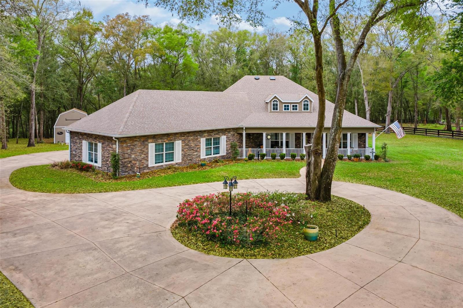 Custom Estate Living on Over 3 Acres – Luxury, Privacy, and Convenience! Welcome to a truly exceptional custom-built estate offering over 3,100 square feet of beautifully crafted living space on 3.14+ acres on a peaceful tree-filled property. Tucked away in a gated community of high-end homes, this one-of-a-kind residence blends elegant craftsmanship, privacy, and convenience in an unbeatable location close to the 429 for easy commuting. From the moment you arrive, the graceful circular driveway and stately presence of the home create a warm and inviting first impression. Situated on a spacious, beautifully wooded lot, the property offers a serene setting with room to breathe while still being just minutes from everyday conveniences. Step inside and you’ll immediately appreciate the custom woodwork of the coffered tray ceilings and fine craftsmanship throughout the home. Thoughtfully designed living spaces bring both comfort and style, making this home perfect for entertaining as well as everyday living. The gourmet kitchen is every chef's dream with abundant cabinet and counter space, oversized center island, large walk in pantry as well as eat- in dining. The formal dining room should you not need it for that use makes a wonderful game room or home office. The expansive layout includes three generously sized bedrooms and two and a half baths. The primary suite in this home is one you will absolutely fall in love with that includes a large sitting area great for reading a book and sipping your morning coffee. The heart of the home flows effortlessly to the outdoor living space where a sparkling salt water heated pool awaits with an outdoor bar area as well as an outdoor shower surrounded by the tranquility of your private backyard oasis. Mature trees and natural landscaping create a peaceful, park-like setting that feels worlds away from the hustle and bustle. For those who appreciate storage and space for vehicles or hobbies, this home features an oversized three-car garage with an AC mini split, providing plenty of room for cars, golf carts, and recreational equipment. On top of all of the storage in the garage that you have you also have a detached workshop/storage. Residents of this community also enjoy lake access, perfect for fishing by the water or watching the sunsets while you take in the natural beauty of the surroundings. The HOA includes cable and internet, adding additional convenience and value. With its sprawling acreage, luxurious custom details, pool for relaxing and prime location, this remarkable property offers the perfect blend of privacy, elegance, and accessibility. Opportunities like this are rare—schedule your private showing today and experience the lifestyle this extraordinary home has to offer!