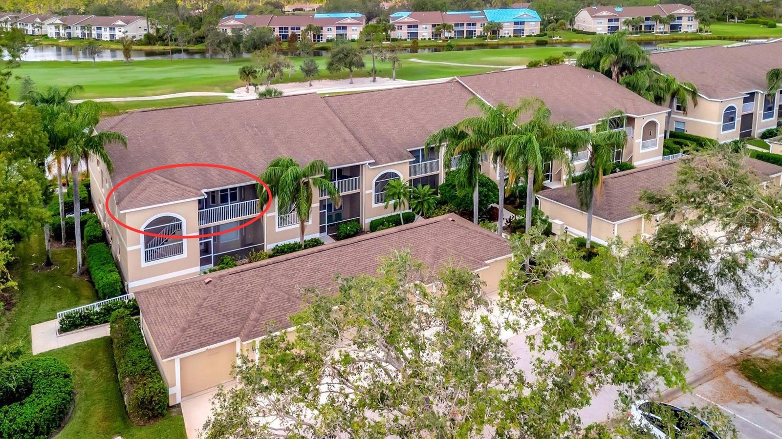 NEW & IMPROVED — Freshly Updated, Beautifully Furnished, and Truly Move-In Ready! Experience breathtaking panoramic views of the golf course, sparkling water, and surrounding preserve from this top-floor corner Abbey floor plan coach home in the highly sought-after Heritage Oaks Golf & Country Club. Offering 1,684 square feet of bright, open living space, this spacious 2-bedroom, 2-bathroom residence with a den and private garage has been thoughtfully refreshed and is ready for immediate enjoyment.

Step inside to discover fresh interior paint, brand-new luxury vinyl plank flooring throughout, stylish new furnishings, and no carpet anywhere. The beautiful kitchen features white cabinetry, granite countertops, stainless steel appliances, and a breakfast bar, all opening seamlessly to the dining and living areas. Soaring vaulted ceilings and abundant natural light enhance the spacious feel.

As a top-floor corner unit, you'll enjoy exceptional privacy and some of the most spectacular views in the community. Relax on the screened lanai while taking in sweeping water and golf course vistas and stunning Sarasota sunsets. The split-bedroom layout offers privacy for owners and guests alike, while the versatile den is perfect for a home office or additional guest space.

Heritage Oaks Golf & Country Club has recently unveiled its beautifully renovated clubhouse, complementing an impressive amenity package that includes championship golf, Har-Tru tennis courts, five heated pools, a fitness center, on-site dining, and an active social calendar—all within a lush gated community. Located just minutes from downtown Sarasota, world-famous beaches, shopping, and dining, this beautifully updated home offers the perfect blend of comfort, convenience, and resort-style living. Simply bring your suitcase and start enjoying the Florida lifestyle.