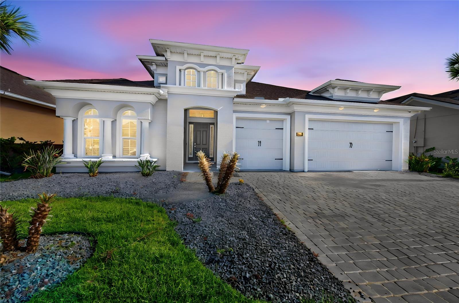 Virtually Staged. Experience elevated Florida living in this better-than-new Davenport floor plan, where every detail has been thoughtfully upgraded to offer the perfect blend of luxury, comfort, and convenience. At just two years old, this exceptional residence allows you to bypass the time, expense, and uncertainty of new construction while enjoying a home that is truly move-in ready.
Nestled within the highly sought-after master-planned community of Mosaic, this stunning 4-bedroom, 3-bath home features a desirable split-bedroom design and an open-concept floor plan that seamlessly blends sophisticated style with everyday functionality. Expansive living spaces are framed by breathtaking lake views that stretch across the great room, dining area, gourmet kitchen, and private owner's retreat, filling the home with natural light and creating an atmosphere of tranquility.
Designed for both entertaining and everyday living, the chef-inspired kitchen serves as the heart of the home, showcasing an oversized center island, quartz countertops, designer backsplash, updated hardware, stainless steel appliances including a range, microwave, refrigerator, abundant cabinetry, and a generous walk-in pantry. Throughout the home, you'll appreciate upgraded ceiling fans with remote controls, elegant tile flooring extending into the owner's suite, plantation shutters accenting the front entry, living room, and sliding glass doors, along with thoughtful upgrades that enhance both style and comfort.
Step outside to your private backyard oasis where an extended covered lanai overlooks a stunning heated saltwater lap pool surrounded by beautiful travertine decking and a screened enclosure. Complete with a handrail, pool alarm, and a recently replaced pool pump, this exceptional outdoor retreat is perfectly positioned to capture peaceful lake views and offers the ideal setting for relaxing or entertaining year-round. Enhanced landscaping, gutters and downspouts, and improved drainage on the west side of the property further reflect the pride of ownership found throughout the home. Even better, the property extends all the way to the pond, providing additional privacy and an exceptional waterfront setting.
The private owner's retreat is a peaceful sanctuary featuring picturesque lake views and a spacious en-suite bath, providing the perfect place to unwind at the end of the day. Additional upgrades include comfort-height toilets, a TV mount in the primary bedroom, and a spacious laundry room. The oversized 3-car garage is equally impressive with its professionally finished epoxy floor, creating a clean and polished space for vehicles, storage, or hobbies.
Living in Mosaic is more than owning a beautiful home—it's embracing an exceptional lifestyle. Residents enjoy resort-style amenities including a spectacular community pool, fishing dock, playground, scenic walking trails, and a vibrant calendar of community events featuring food trucks, Pet Palooza, and neighborhood gatherings.
Ideally located just minutes from Tomoka Town Center, you'll enjoy convenient access to premier shopping, dining, and entertainment, with I-95 and I-4 nearby for effortless travel. Daytona Beach and the Atlantic Ocean are only a short drive away, placing the best of Central Florida right at your fingertips.
Luxury without the wait. Every premium upgrade has already been completed, allowing you to move right in and begin enjoying the elevated Florida lifestyle you've been waiting for.