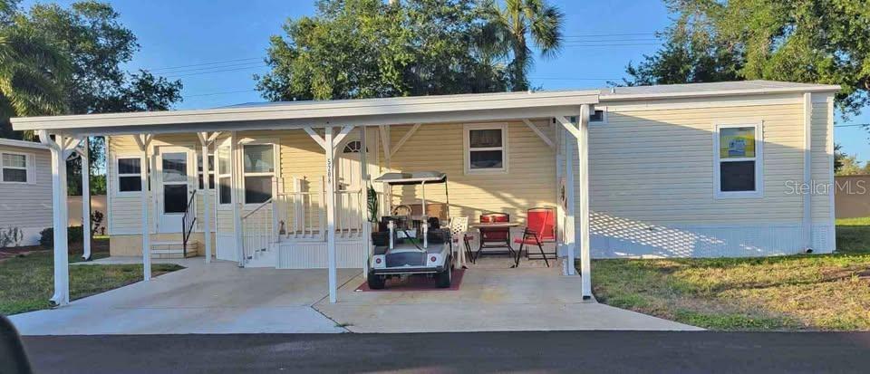 You're gonna love this meticulous 2 bedroom, 2 bath, Manufactured Home in pristine Golf Lake Estates. Land owned. 55+ Gated Community! No pets. Home sits back on a cul-de-sac. Covered carport big enough for your car , also for the golf cart included in sale by seller's. Open inside laundry closet. Home features open floor plan with 2 full bathrooms,  2 bedrooms. Primary bedroom has a walk-in closet. The bonus room is suitable for a 3rd bedroom.  Sellers have taken alot of "pride" in their homeownership.  After purchasing in 2015, they continued with multiple updates! In 2016 - New Roofover - Weather Lock, new vinyl siding, windows & doors. Screenroom redone to spare room done by AMS. 2018 - New Sears Refrigerator and Range. 2019 - New Air Conditioner by AirExperts. 2019 - new water heater.  2020 - replumbed entire house. Also replaced all sub floors and put in  new laminate flooring. 2021 - Home was leveled and new vapor barrier  (underhome Armour). 2022- new toilets. 2023 - new washer & dryer. 2024 - GCSC tie downs and new anchors all around home & new entry steps. WOW!   Active community has a fully equipped clubhouse swimming pool, heated spa, fitness center, pickleball, shuffleboard, lawn bowling courts.  A pitch & putt golf course for the avid golfers. Even yoga, dance and singing clubs. For those who love to keep busy.   This is the community for you!  Furnishings are included except personal items. Call for your exclusive showing today!
