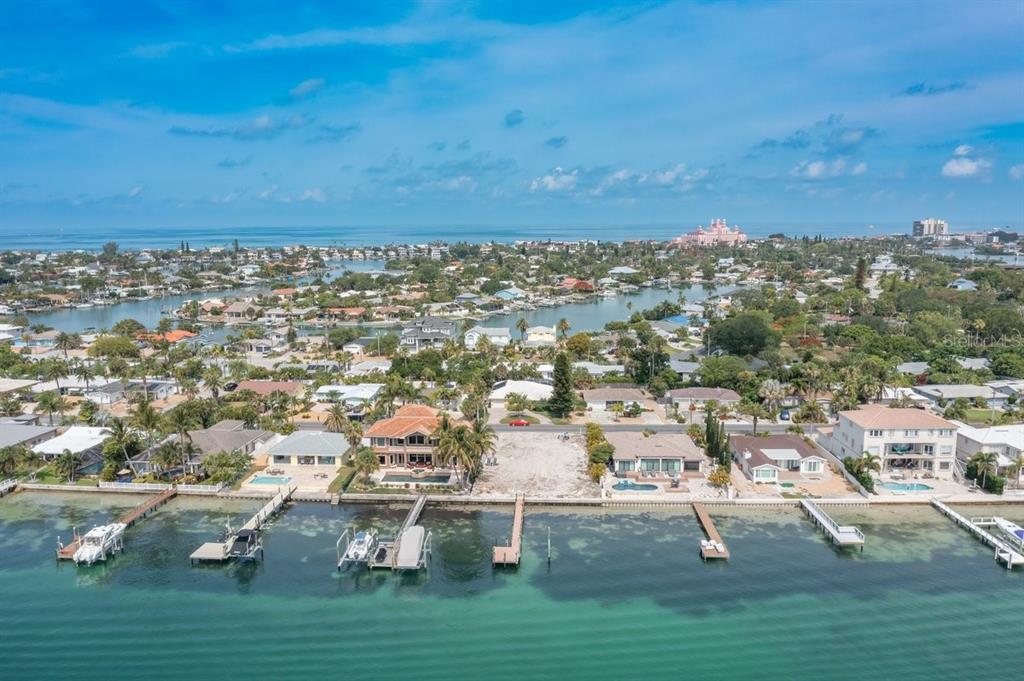 The only vacant lot in sought after Vina del Mar neighborhood!  Spectacular views of Tierra Verde and Sunshine Skyway Bridge, plus minutes away by boat from Gulf of Mexico for beautiful sunsets.  Enjoy the gulf breezes while watching sea life and boats go by on the intercoastal waterway.  A short golf cart ride to Pass a Grille shops, restaurants and of course the beach!