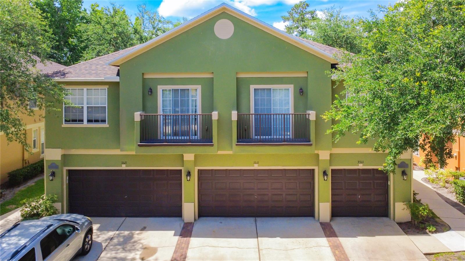 Rare opportunity to own a spacious END-UNIT townhome in the GATED community of Magnolia Club, featuring one of the larger floor plans in the neighborhood and peaceful WATER VIEWS from the rear of the home. With extra privacy beside open green space and an inviting OPEN-CONCEPT design, this home blends comfort, function, and location.  Spacious CAR GARAGE.
Inside, the main living area seamlessly connects the living room, dining room, and kitchen, creating a bright and versatile layout ideal for everyday living and entertaining. The BEAUTIFUL KITCHEN is upgraded with STAINLESS STEEL appliances, GRANITE countertops, and a BREAKFAST BAR overlooking the main living space. Just beyond the dining area, enjoy relaxing WATER VIEWS from the back of the home.
The first floor also features a full-size laundry room with shelving and additional storage space. Upstairs, you’ll find SPACIOUS BEDROOMS with laminate wood flooring, MODERN LIGHTING, and convenient access to a shared full bathroom. The PRIMARY SUITE is privately positioned upstairs and offers a LARGE EN SUITE BATHROOM with generous space to unwind.
Residents of Magnolia Club enjoy GATED access, community amenities including a POOL and CLUBHOUSE, and quick access to the 417, Sanford International Airport, shopping, dining, and entertainment. LOW-MAINTENANCE living in a location that keeps you connected to everything Central Florida has to offer.