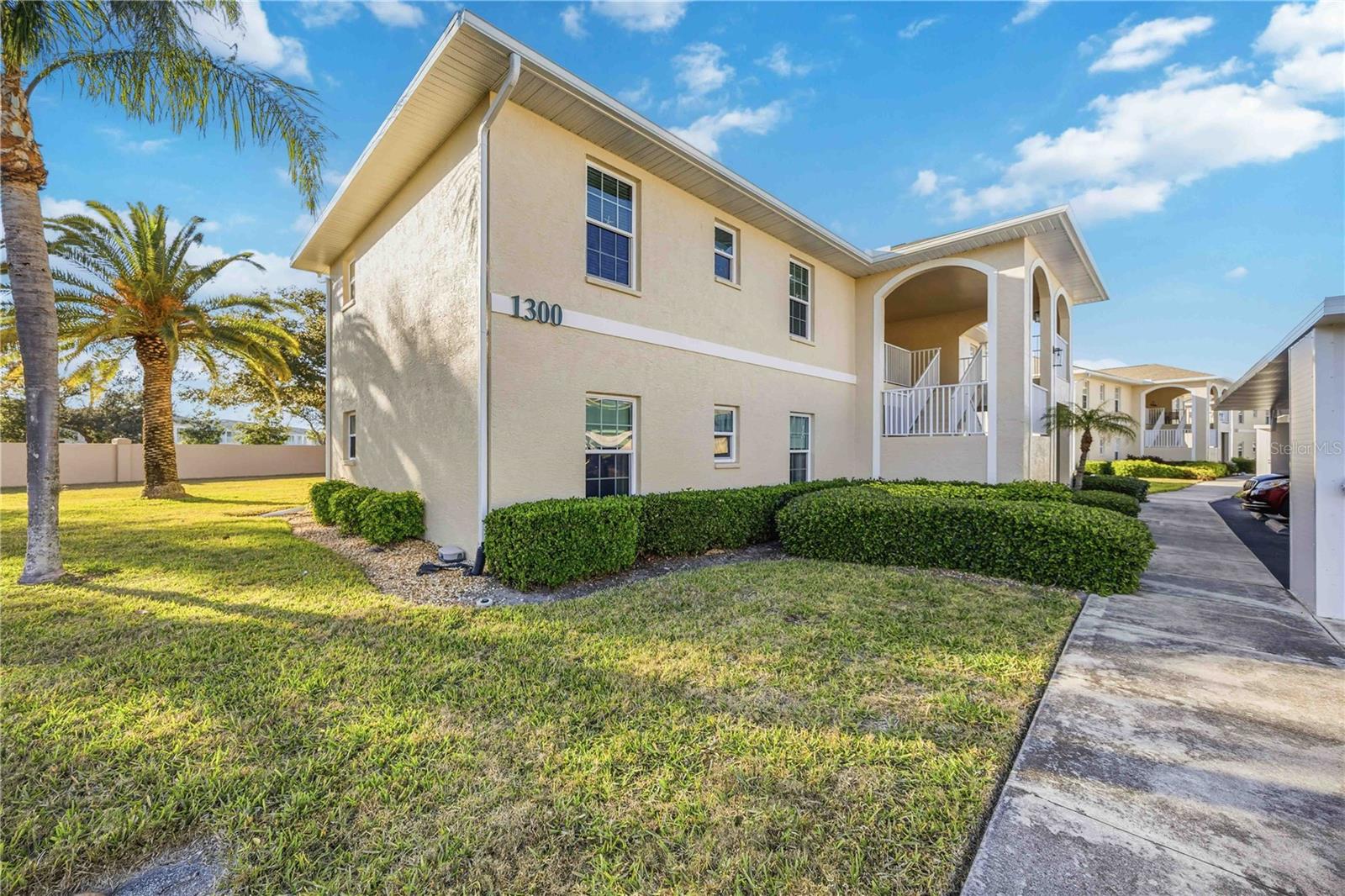 WOW, NEW PRICE! EXCEPTIONAL VALUE!!  Come enjoy this beautiful completely updated MOVE IN READY 2 bedroom 2 bath condo in Sabal Trace at Linkside! This spacious home with over 1300 sq ft is light and bright with new 32”X32” soft gray porcelain tile throughout the main living area. Lots of windows to allow in the natural light and provide a great open feel. The updated kitchen is enhanced with new appliances, white cabinetry with under cabinet lighting and recessed over cabinet lighting, rich looking quartz counter tops, and window over the stainless steel sink. The dinette area just off the kitchen is surrounded by windows for even more of an open feel… the perfect place to start your day! The combination dining room, with new light fixture, and living area are complimented with sliding doors that lead out to your private balcony. The generous size primary bedroom has new carpeting, with ensuite bath, two closets, walk in shower, vanity with dual sinks. The primary bedroom also features sliding doors that lead out to your private balcony.  This is a true split floor plan with the nice size guest bedroom, with new carpeting, is located on the opposite side of the home providing the ultimate in privacy for you and your guests.  The adjacent guest bathroom offers a shower/tub combination, white cabinet vanity. Lots of extras in this special home including, nice size laundry room, large storage closet, storm door, all new comfort height commodes, all freshly painted inside, Hunter Douglas blinds and Vertiglide shades, updated plumbing fixtures, newer AC 2022, and newer water heater 2023!  The HOA is making all repairs from previous storms to the Linkside Community and it will be back to it previous glory to make everything like new again!  Roof replacements, repairs, painting, new carports and dumpster areas have been completely rebuilt.  This location is ideal, close to restaurants, shopping, local beaches, Cool Today Park and Warm Mineral Springs. NOW is the time to make this home yours and enjoy the carefree Florida lifestyle!