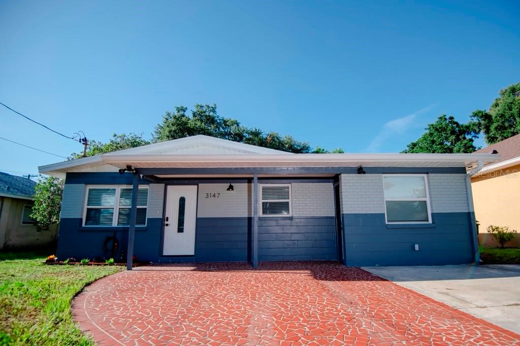 Recently renovated and move-in ready 3BR/1BA home with 1BR/1BA in-law suite (with separate entrance). The main house is beautifully updated with open floor plan, quartz countertops, Samsung stainless steel appliances, newer breaker panel, Rheem water heater, and a 2022 A/C unit. Featuring 3 bedrooms, updated bathroom, plus a versatile den/office/hobby room, spacious living and dining areas, a dedicated laundry room, and abundant storage. The master bedroom opens to a spacious covered patio. The private backyard provides ample space for shaded relaxing or entertaining. Conveniently located less than a mile from Raymond James Stadium, just over 4 miles from Tampa International Airport, under 5 miles from Tampa General Hospital, and minutes from parks, shopping, dining, and downtown Tampa. An excellent opportunity for homeowners or investors seeking a prime short-term or long-term rental property.