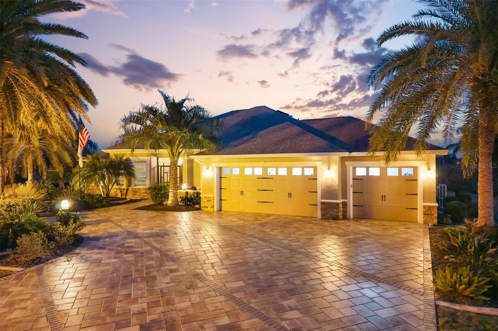 BOND PAID! Welcome to one of the most exceptional homes in The Villages®—a true Premier residence and the largest model built, perfectly positioned on a rare water and preserve homesite offering privacy, tranquility, and picturesque views.

This meticulously upgraded home features tile flooring throughout with **enclosed Lanai under heat and air totaling 4540 Square Feet**. Elegant crown molding in every room, and a custom gourmet kitchen with stainless steel appliances, granite countertops, abundant cabinetry, and an indoor gas stove powered by a 500-gallon propane tank—ideal for both entertaining and everyday living.

Step outside to your private resort-style oasis featuring a saltwater, solar-heated pool, further enhanced by the 500-gallon propane tank, which also supplies additional pool heating and the outdoor kitchen, allowing for comfortable year-round enjoyment. The peaceful water and preserve backdrop creates a truly serene setting.

Additional highlights include professionally maintained landscaping, front driveway pavers, and an extended 3-car garage offering ample space for vehicles, golf carts, and storage. Major upgrades provide peace of mind, including a roof replaced within the last 5 years and the highly desirable Bond Paid, offering substantial savings.

Homesites like this are rarely available—this is a one-of-a-kind opportunity in The Villages®, where luxury, location, and lifestyle come together beautifully.