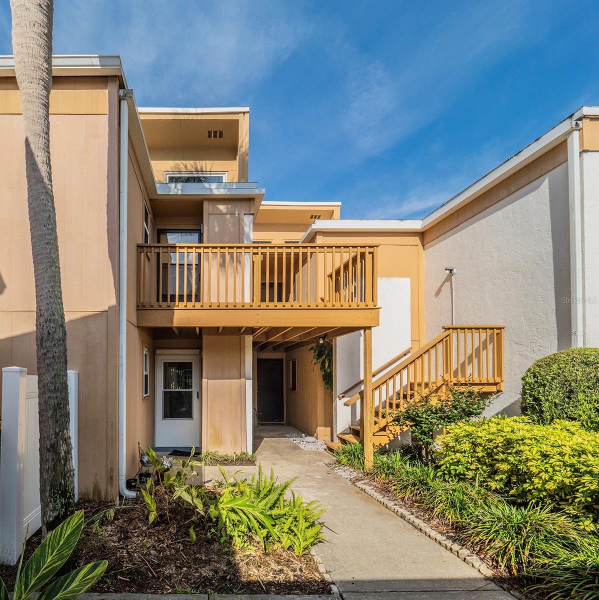 Welcome to this beautifully updated 2-bedroom, 2-bath condo located in the heart of Mount Dora being sold furnished. Set within a charming two-story community, this second-floor unit features an open floor plan with vaulted ceilings and abundant natural light from expansive windows and sliding glass doors. The inviting living room includes a cozy fireplace, while the kitchen offers stainless steel appliances, a breakfast bar, and a side pantry closet. The primary suite provides private access to the back porch, along with a bathroom featuring dual sinks and a walk-in shower. Upgrades include an Amana A/C unit (2024), Renewal by Andersen east-facing living room windows (2022), laminate plank flooring (2021), and lighting fixtures in the kitchen and dining areas. Enjoy relaxing on the spacious back porch with serene views of the landscaped community grounds and pool—an ideal spot to take in Florida’s breathtaking sunsets. Just a short walk to Lake Dora and minutes from downtown Mount Dora’s shops, dining, and cultural attractions, this well-maintained condo offers comfort, convenience, and location. Schedule your showing today!