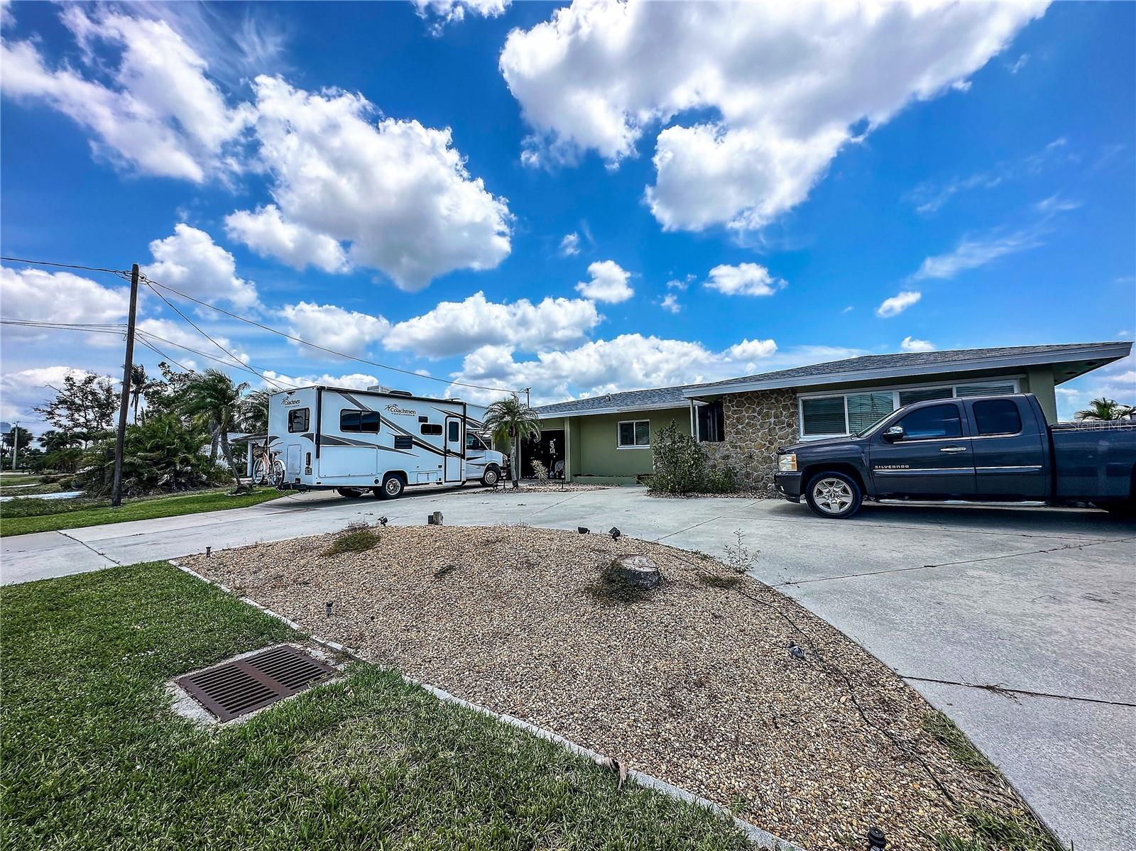 "High Ground: A Desirable Location with No Flood or Hurricane Damage"
Don't miss out on the opportunity to own a property in the highly sought-after Palaco Grande neighborhood, where high ground ensures protection against flood & hurricane damage as it is Flood Zone X500, meaning it is outside the flood zone. This 3-bed, 2-bath home offers direct gulf access & is conveniently located just minutes away from the river, with no bridges to restrict boat navigation. Simply hop in your boat & enjoy the open water! Additionally, the home features a concrete boat dock with 2 davits, providing a secure space for your watercraft. The circle driveway offers ample parking space for multiple vehicles. The property boasts recent upgrades, including a new AC system installed in 2022 and a new roof scheduled for 2023. With plenty of room available, there is potential for a custom pool to be added, enhancing the outdoor living experience. Conveniently situated off of Del Prado near the Mid-Point bridge, this home allows for easy access to year-round Florida living. Whether by car or boat, residents can effortlessly reach excellent shopping, restaurants, and beaches. Agents, please refer to the remarks for additional information.