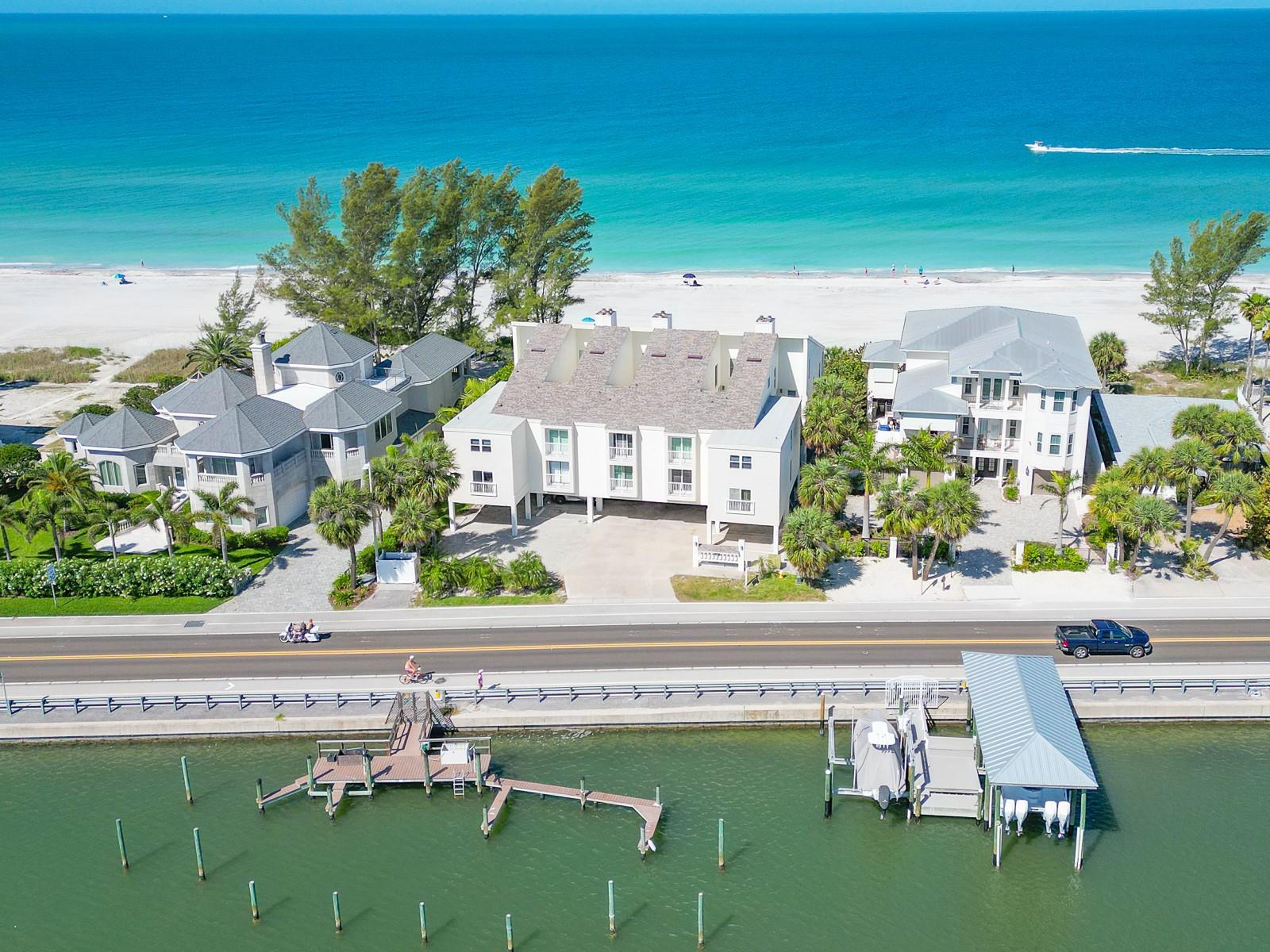 Rare opportunity to own a fully remodeled beachfront condo in Indian Shores ideally positioned between the Gulf and the Intracoastal Waterway, offering direct beach access, water views, and strong short-term rental potential. This 2-bedroom, 2-bath residence with 1,340 sq ft delivers refined coastal living with an open-concept layout, perfect for entertaining or relaxing. Renovated in 2021–2022, the interior features driftwood-style porcelain tile throughout, designer finishes, and abundant natural light. The chef’s kitchen showcases custom cotton color shaker cabinetry, quartz countertops with coastal blue accents, premium appliances, a 48-inch Sub-Zero refrigerator, and a 5-burner range. The spacious living area includes a wood-burning fireplace, flexible workspace, and built-in Murphy bed for added versatility. The primary suite offers Intracoastal water views, a walk-in closet, and en-suite bath, while the guest suite provides additional sleeping capacity and workspace.  Recent upgrades include hurricane shutters (2023) and impact-rated sliders (2024) for enhanced protection and efficiency. Enjoy seamless indoor-outdoor living with a private beachfront patio and access to a gulf-front terrace with lounge seating, gas grill, and outdoor bar area. Parking spaces are first come first serve,but you are guaranteed two per unit, under-building storage, and first-come boat slips. Zoned for weekly rentals, this property offers exceptional flexibility as a primary residence, vacation home, or income-producing investment. Conveniently located near dining, bars, shopping, parks, bike trails, and within easy access to Tampa International Airport. Don’t miss your chance to own a premier beachfront property in Indian Shores—schedule your private showing today.
