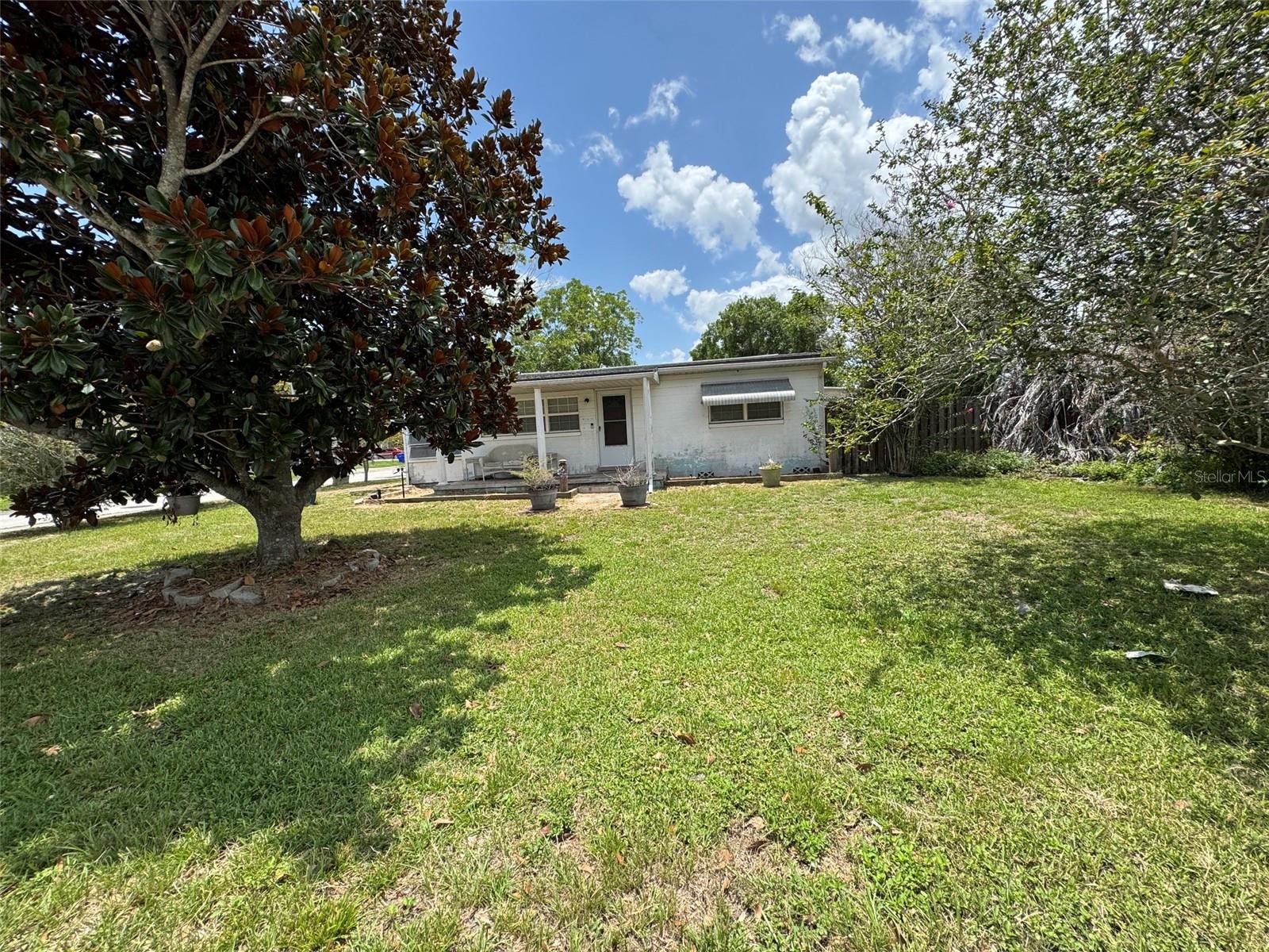 Handy man special! Great opportunity for a multi-generational home. The attached IN-LAW suite just needs your special touch to make it your own. With a separate entrance it has great potential! Sink and cabinets are already in place as well has the hookup for a stove and fridge. The bathroom has a walk in shower with unique vintage tile. The main home has 2 bedrooms and 1 bath as well as a spacious living room and large kitchen.