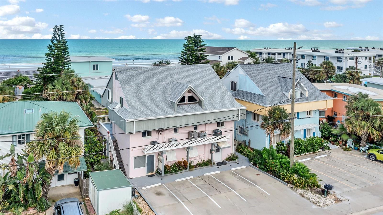 Uncover the ultimate investment gem – a remarkable TRIPLEX nestled just a heartbeat away from the beach! Embrace the coastal dream with two exquisite 2-bed, 2-bath apartments, complemented by a spacious 2-bed, 1.5-bath unit; a perfect blend of comfort and convenience. Revel in seamless beach access without crossing busy streets, while relishing a peek-a-boo ocean view, an outdoor shower, and newly upgraded "maintenance-free wood" stairs leading to the balconies. Feel secure with hurricane-grade windows, and delight in being minutes away from Flagler Ave's shopping and entertainment. This rare SHORT-TERM RENTAL zone promises an exceptional INVESTMENT opportunity – own your slice of paradise today! ;Water: City