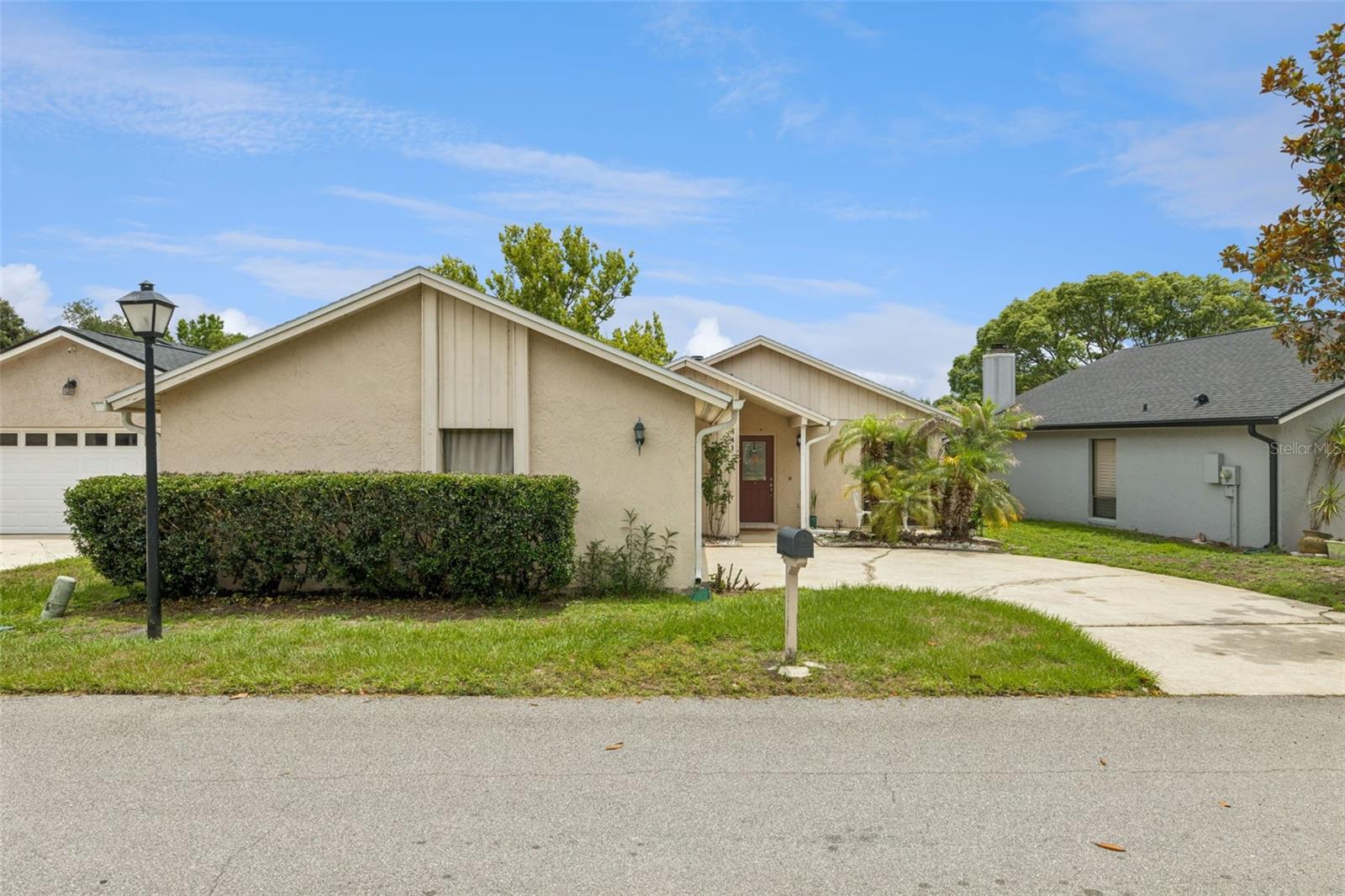 Welcome to this beautifully maintained and updated 3 bedroom, 2 bath home with a 2-car garage, ideally situated in the highly desirable Tuscawilla community of Winter Springs. Offering a combination of modern updates, timeless character and serene waterfront views, this move in ready home is a rear find. Step inside to discover an inviting floor plan, featuring ceramic tile and laminate flooring throughout, providing both style and easy maintenance. The updated kitchen is designed for everyday living and entertaining, complete with modern cabinetry, stainless steel appliances, granite countertops, with a black side by side refrigerator, skylight that fills the space with natural light and a built-in wine rack for added charm. The spacious family room serves as the heart of the home, highlighted by a striking brick wood burning fireplace and elegant exposed wood beams that adds warmth and architectural character. Sliding glass doors create a seamless connection between the indoor living spaces and the outdoors while framing beautiful views of the pond. Relax and unwind in the screened in porch overlooking the tranquil water, where you can enjoy peaceful mornings, evening sunsets and the beauty of Florida's natural surroundings. The primary suite and additional bedrooms offer comfortable living spaces, with sliding glass door access providing abundant natural light and picturesque views. The home also offers valuable peace of mind with major updates already completed, including a new roof installed in 2022 and a new HVAC system installed in 2021. Located in the sought after Tuscawilla community, residents enjoy convenient access to parks, walking trails, golf, tennis facilities, shopping, dining, and top rated Seminole County schools. Whether you are looking for your forever home or a peaceful retreat, this waterfront gem delivers comfort, convenience and lasting value. Don't miss your opportunity to own this beautifully updated pond-view home in one of Winter Springs' most desirable neighborhood.