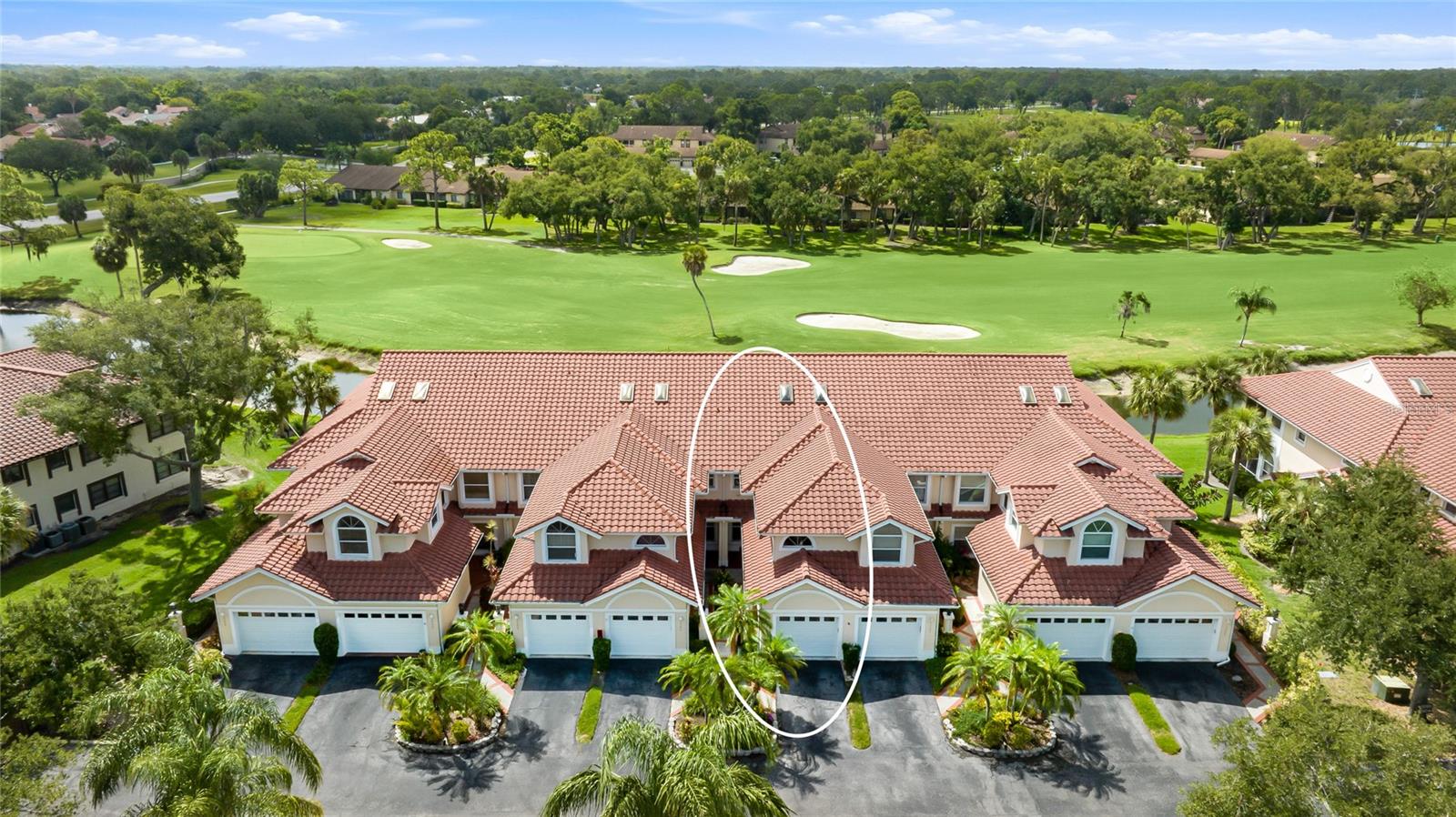 Step into a slice of Florida living in this beautifully maintained ground-floor Mediterranean carriage home, perfectly positioned in Callaway Glen at Golf Pointe within the sought-after Palm Aire community. Sweeping golf course and water views greet you the moment you walk through the door, with a freshly painted interior, high ceilings, and graceful archways adding to the bright, welcoming feel throughout. What truly sets this home apart is its distinctive layout. A few steps down from the elevated entryway leads you into the sunken main living space, where the living and formal dining areas flow together as one warm, open gathering spot full of architectural character. Walls of sliding glass open the home to its serene fairway and water backdrop, while the enclosed Florida room serves as a peaceful, year-round retreat to unwind, read, or take in the view. Two well-sized bedrooms, two full baths, and a sun-filled breakfast nook overlooking the greenery round out the thoughtful layout, making this home equally suited for relaxed mornings and easygoing entertaining. The kitchen blends function and warmth with granite countertops, wood cabinetry, a tiled backsplash, and stainless steel appliances. The primary suite is a comfortable haven featuring a granite double-sink vanity, generous storage, and built-in closet systems, while ceramic tile flooring carries seamlessly throughout. An oversized one-car garage provides everyday convenience and added storage. Life at Golf Pointe means two heated community pools and beautifully kept mature grounds that are covered within the HOA, leaving you free to enjoy everything Florida has to offer. Tucked just west of I-75, you're minutes from the premier shopping at UTC Mall, Sarasota-Bradenton International Airport, vibrant downtown Sarasota, and the world-class Gulf beaches the area is known for. Golf and social enthusiasts will love that the optional private Palm Aire Country Club is just a quick golf cart ride away, offering golf, tennis, and social memberships, with members welcome to drive their own carts right to the club. **THIS PROPERTY QUALIFIES FOR A 1% LENDER INCENTIVE IF USING PREFERRED LENDER. INQUIRE FOR MORE DETAILS.**