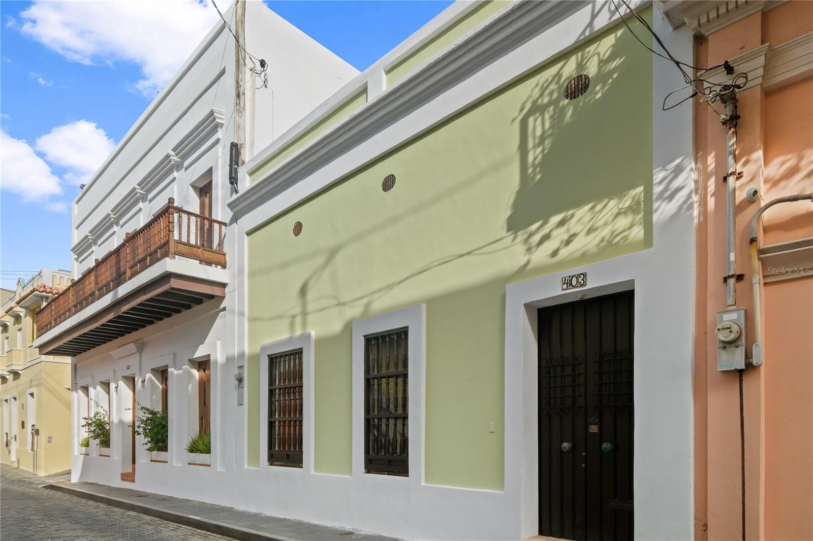 Located on iconic Luna Street in the heart of Old San Juan, this exceptional historic residence offers the perfect blend of colonial charm and modern comfort. Featuring five spacious bedrooms and five full bathrooms, the home is thoughtfully designed for both elegant living and flexible use. Soaring high ceilings and abundant natural light enhance the sense of openness throughout. The layout flows beautifully around a serene interior patio, creating a private oasis ideal for relaxation or entertaining. Original architectural details are complemented by tasteful updates, preserving the character of Old San Juan while offering contemporary functionality. A generous terrace provides additional outdoor living space, while the rooftop terrace showcases breathtaking views of the colorful cityscape and historic surroundings — the perfect setting for sunset gatherings or quiet mornings. Situated steps from renowned restaurants, galleries, and historic landmarks, this Luna Street property is a rare opportunity to own a piece of Old San Juan’s timeless beauty.