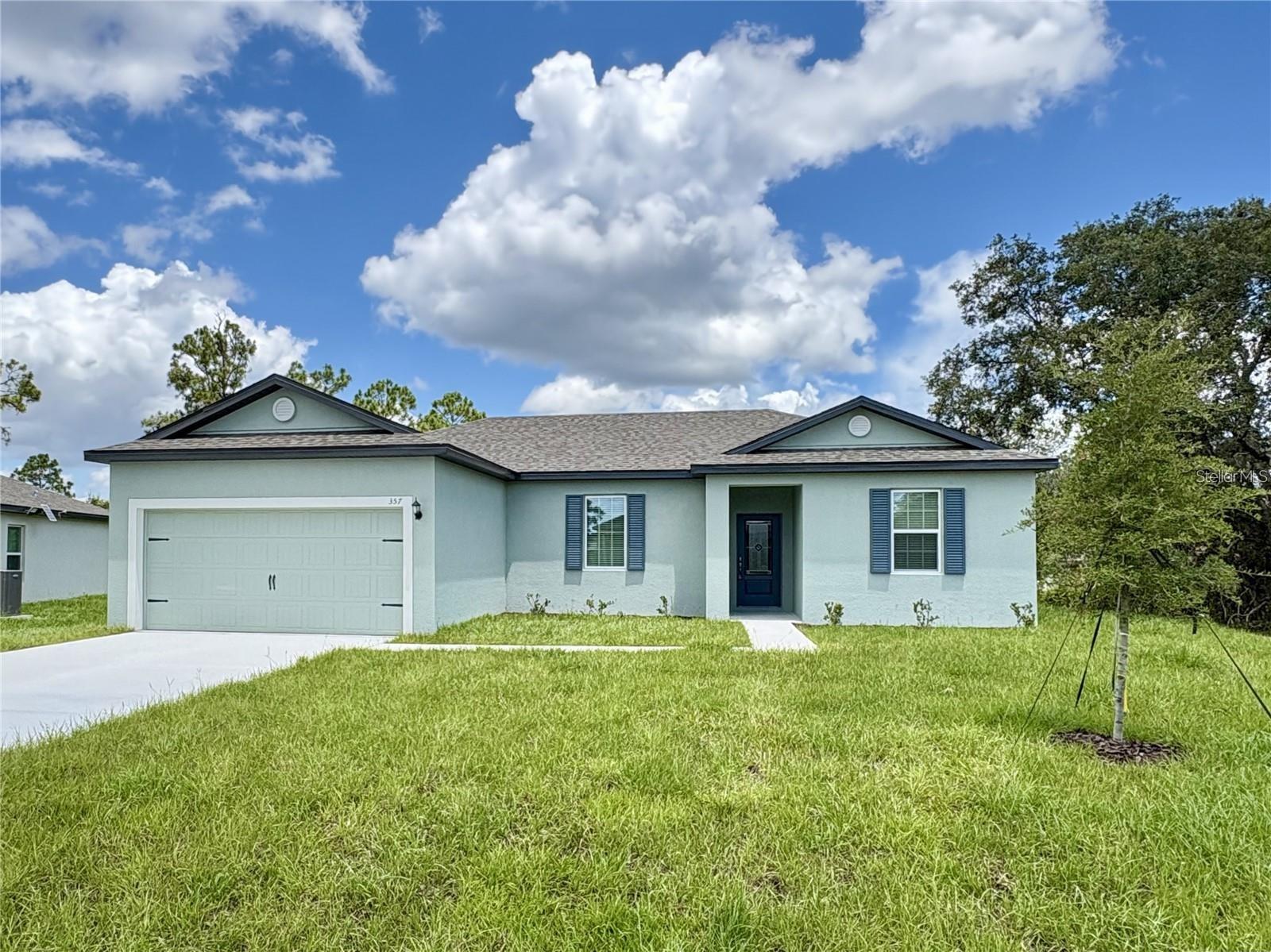 Experience the perfect blend of affordability, modern design, and low-maintenance Florida living in this brand-new 2025 home located in the growing community of Poinciana in Central Florida. Ideal for buyers seeking a move-in ready primary residence with builder incentives, this beautifully designed LGI Homes “Crane” model offers 3 bedrooms, 2 bathrooms, and an open-concept layout designed for today’s lifestyle. 
The spacious kitchen serves as the heart of the home and features granite countertops, solid wood cabinetry with crown molding, stainless steel Whirlpool appliances, a large center island, and seamless flow into the dining and living area perfect for entertaining or everyday living. High ceilings, luxury vinyl flooring in the main living spaces, energy-efficient features, double-pane Low-E windows, and smart-home conveniences including USB outlets and a Wi-Fi-enabled garage door opener add both comfort and value. 
The private owner’s suite offers a walk-in closet and en-suite bath with stone countertops, while the split-bedroom floorplan provides flexibility for guests, a home office, or growing households. Outside, enjoy professionally designed landscaping, irrigation, covered outdoor space, and peaceful wooded surroundings that create a quiet suburban feel while still being conveniently connected to shopping, dining, schools, and major commuter routes. 
Residents enjoy access to resort-style community amenities including swimming pools, fitness center, dog park, playgrounds, basketball and tennis courts, sports fields, walking trails, and recreational facilities—all with low HOA fees that include cable and internet. 
Conveniently located within reach of Orlando attractions, Disney area employment corridors, Lakeland, and major Central Florida growth areas, this home presents an outstanding opportunity for buyers looking for affordable new construction in a rapidly developing market. FHA, VA, and Conventional financing options available.