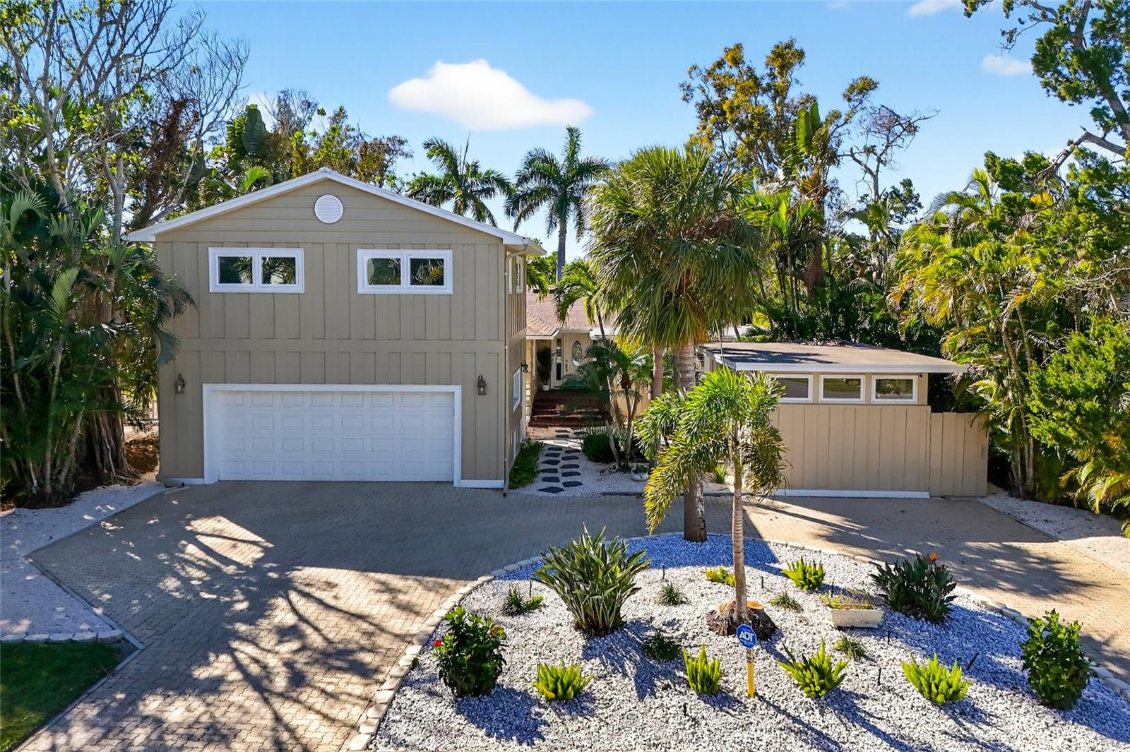 Welcome to 6851 Longboat Drive South, a completely renovated waterfront retreat offering the best of Longboat Key living. This exceptional residence features four bedrooms and four baths, including a private guest suite above the garage, and office/gym space, making it ideal for hosting family and friends in comfort and style. Designed with coastal elegance in mind, the home showcases light-filled living spaces, a modern open layout and high-quality finishes throughout. The seamless indoor-outdoor flow leads to tranquil waterfront views, ideal for entertaining or unwinding after a day on the water. Boaters will appreciate the private dock, providing direct access to the bay and making it easy to enjoy fishing, cruising or sunset rides right from your backyard. Every detail has been thoughtfully updated, offering peace of mind and turnkey convenience. Just minutes from the Gulf beaches, St. Armands Circle and Longboat Key Club, this property delivers a rare opportunity to own a move-in-ready waterfront home in one of Florida’s sought-after island communities.